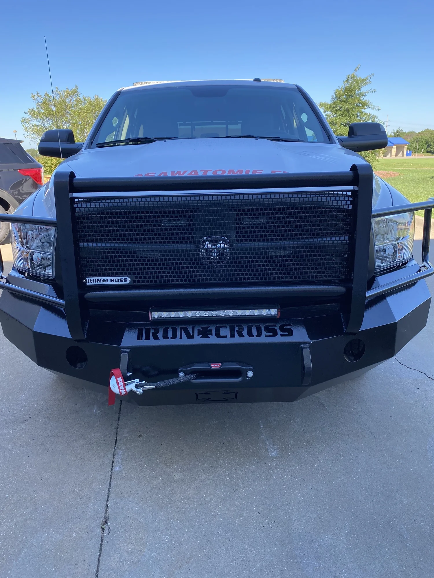 Heavy-duty front bumper and winch system installed on a public-safety truck