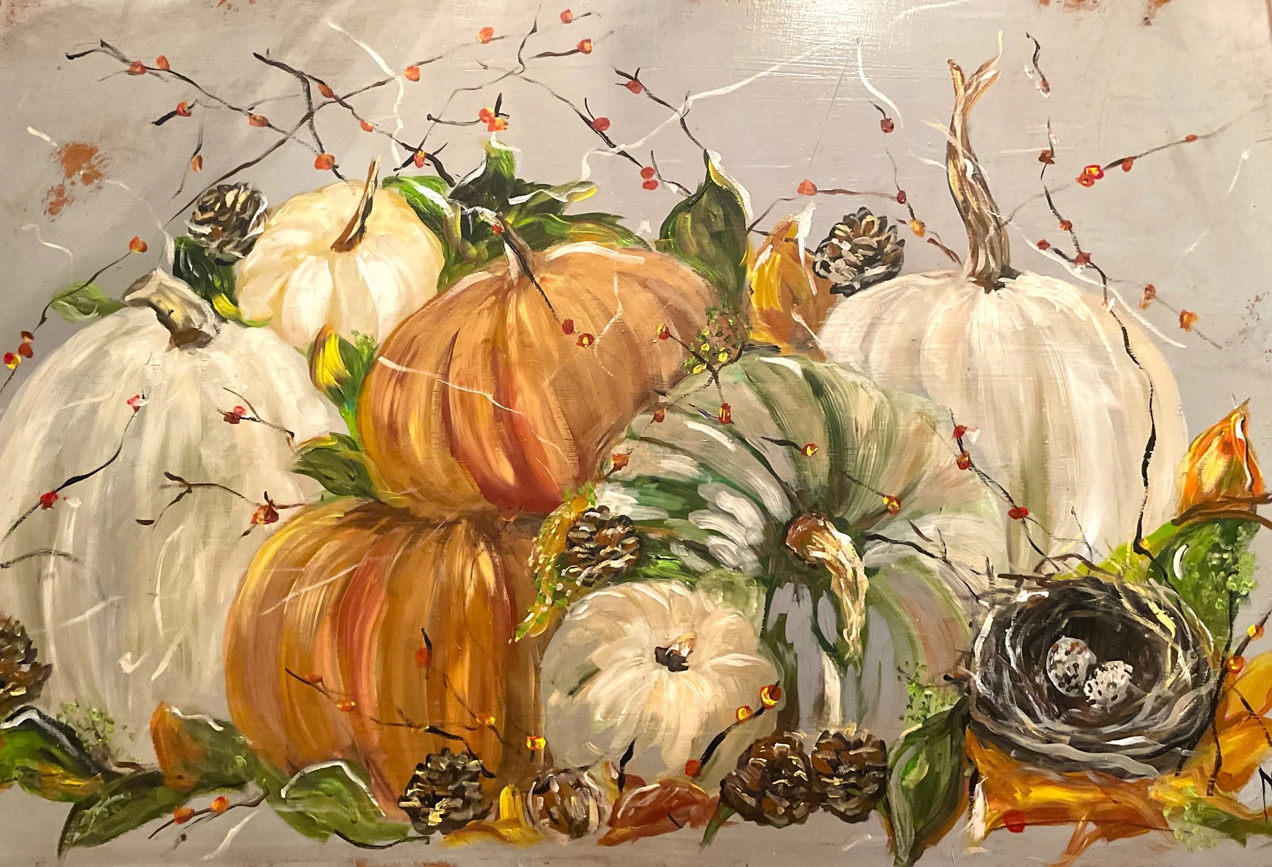 Painting of pumpkins with fall leaves and branches
