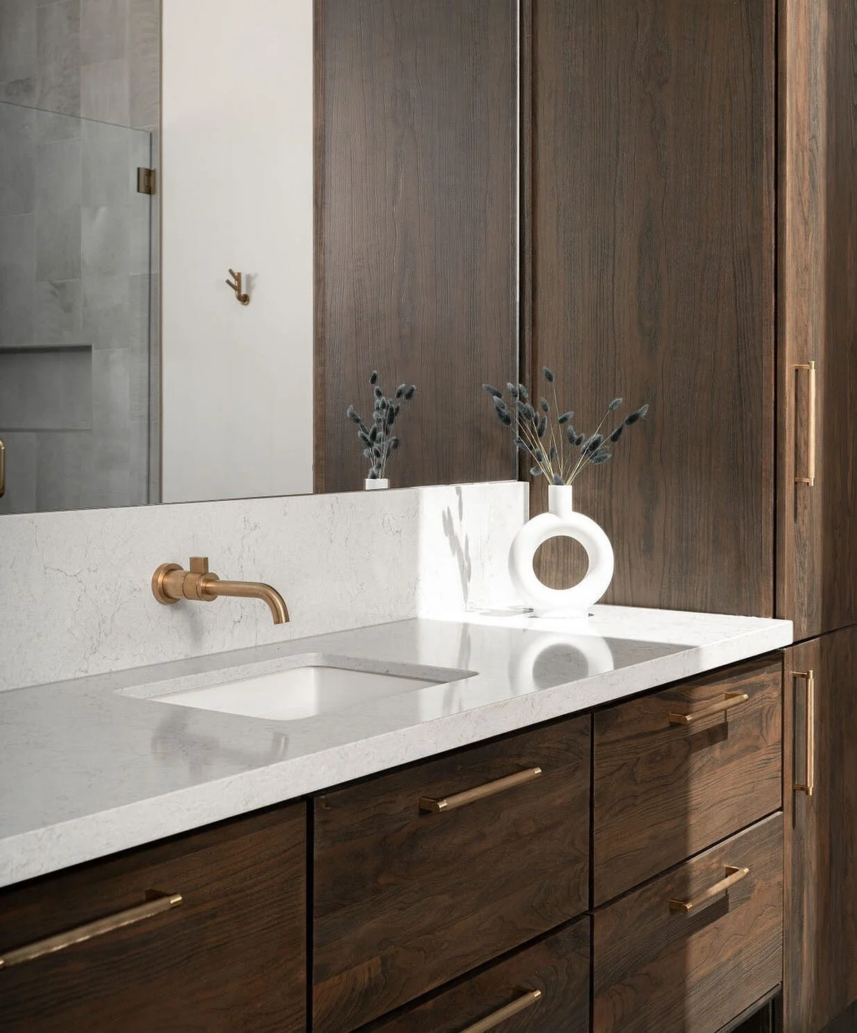 Simple quality. It’s pretty amazing that you really do not need much in a space when quality is present. 
.
The weighty-ness and etched texture of these plumbing and hardware fixtures is quite grounding for the open and airy space. Quality spea
