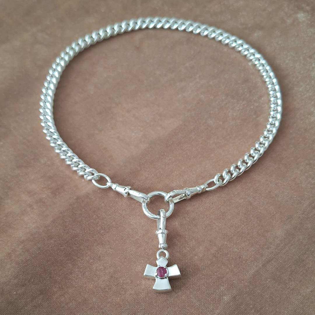 Love-Ruby-set-cross-on-silver-curb.jpg