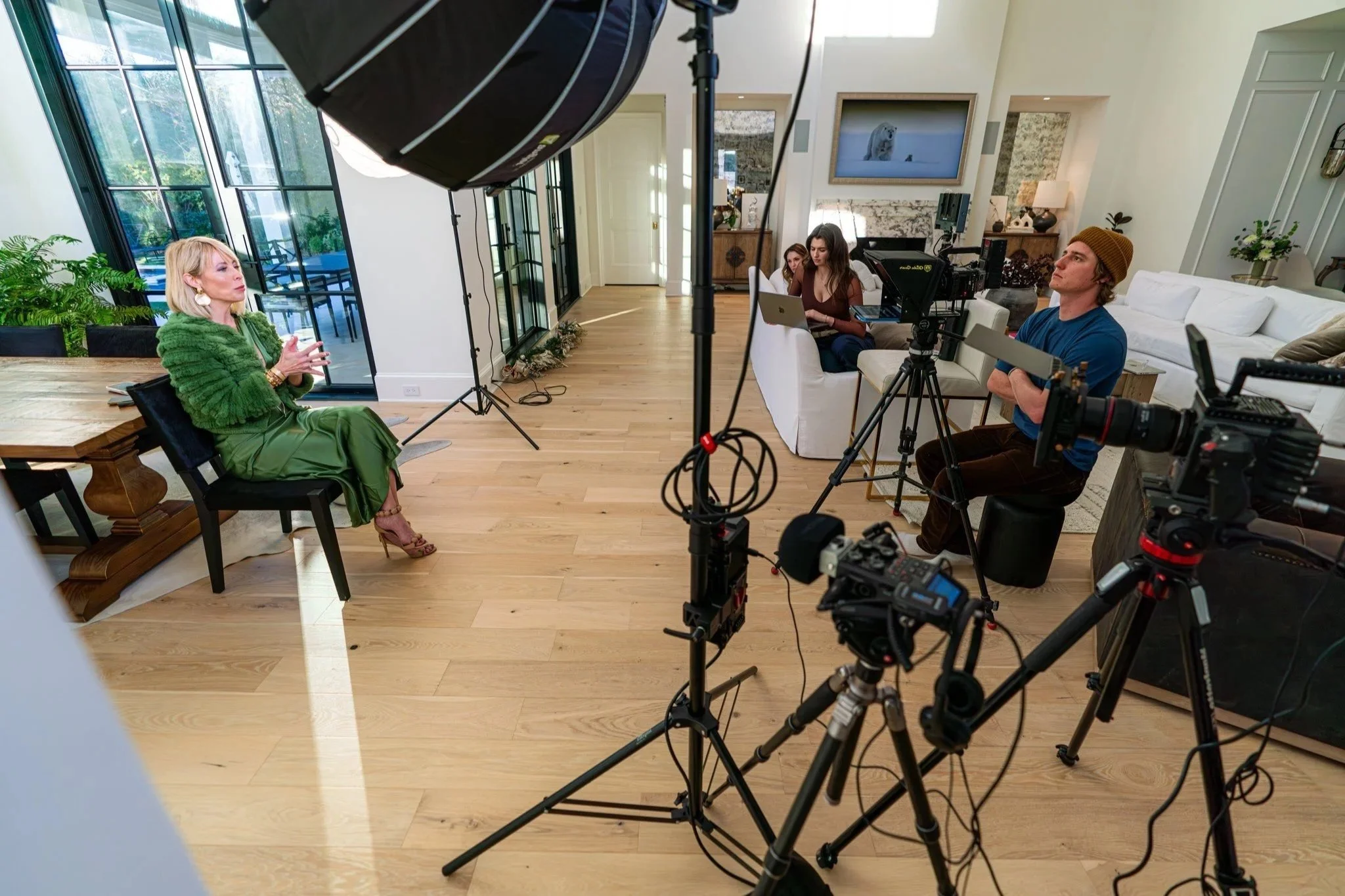 Multi-camera interview production with professional lighting, cameras and crew on location.