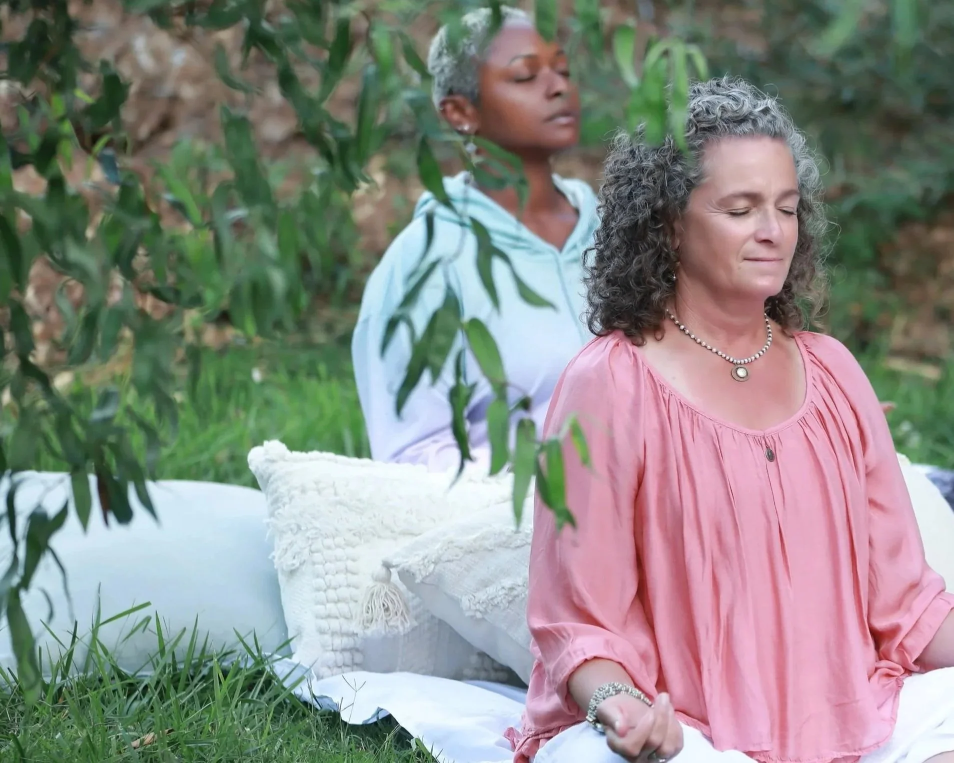 women in relaxing meditation breathwork pose
