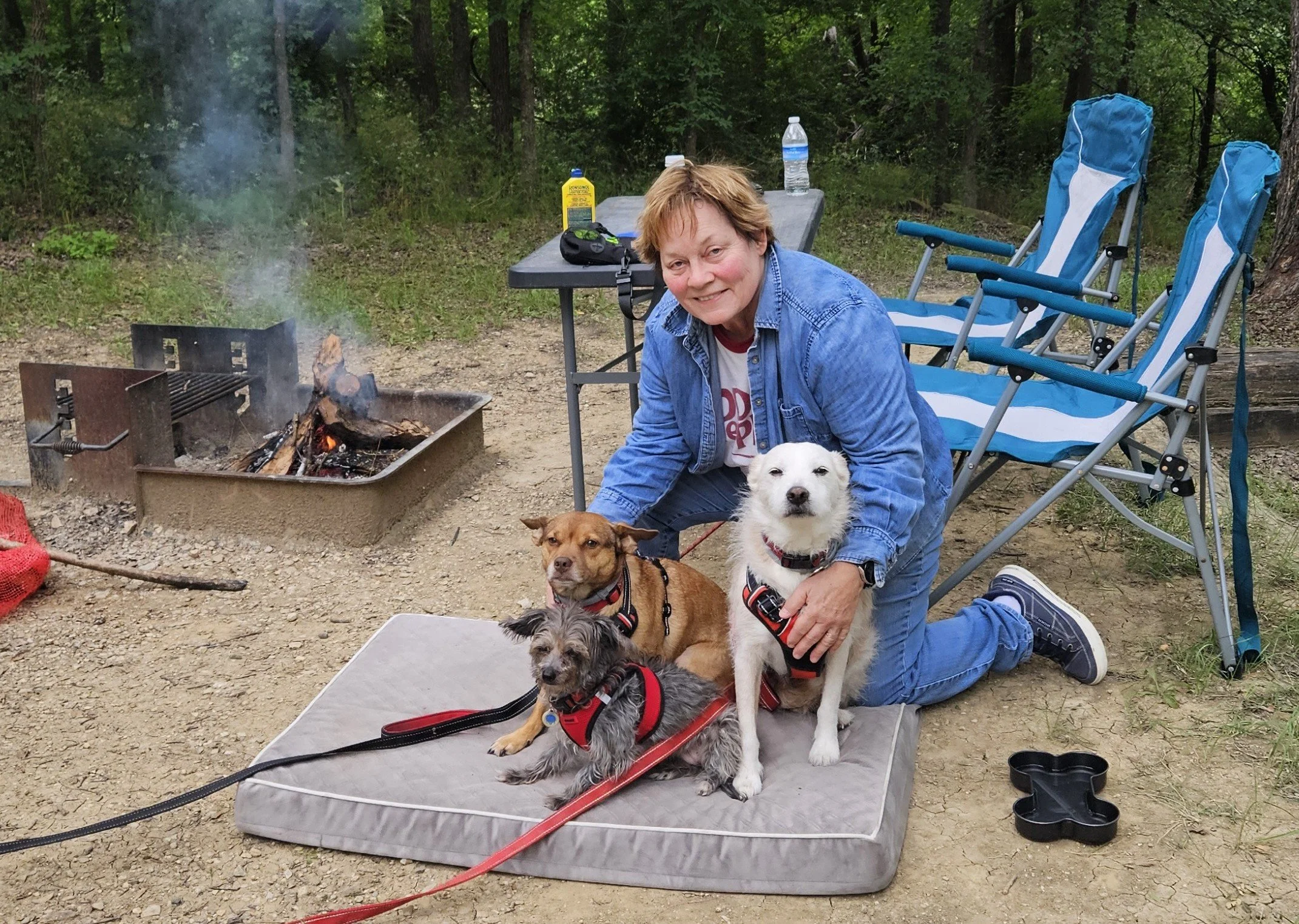 Arden Moore with her three dogs at Cedar Hill State Park