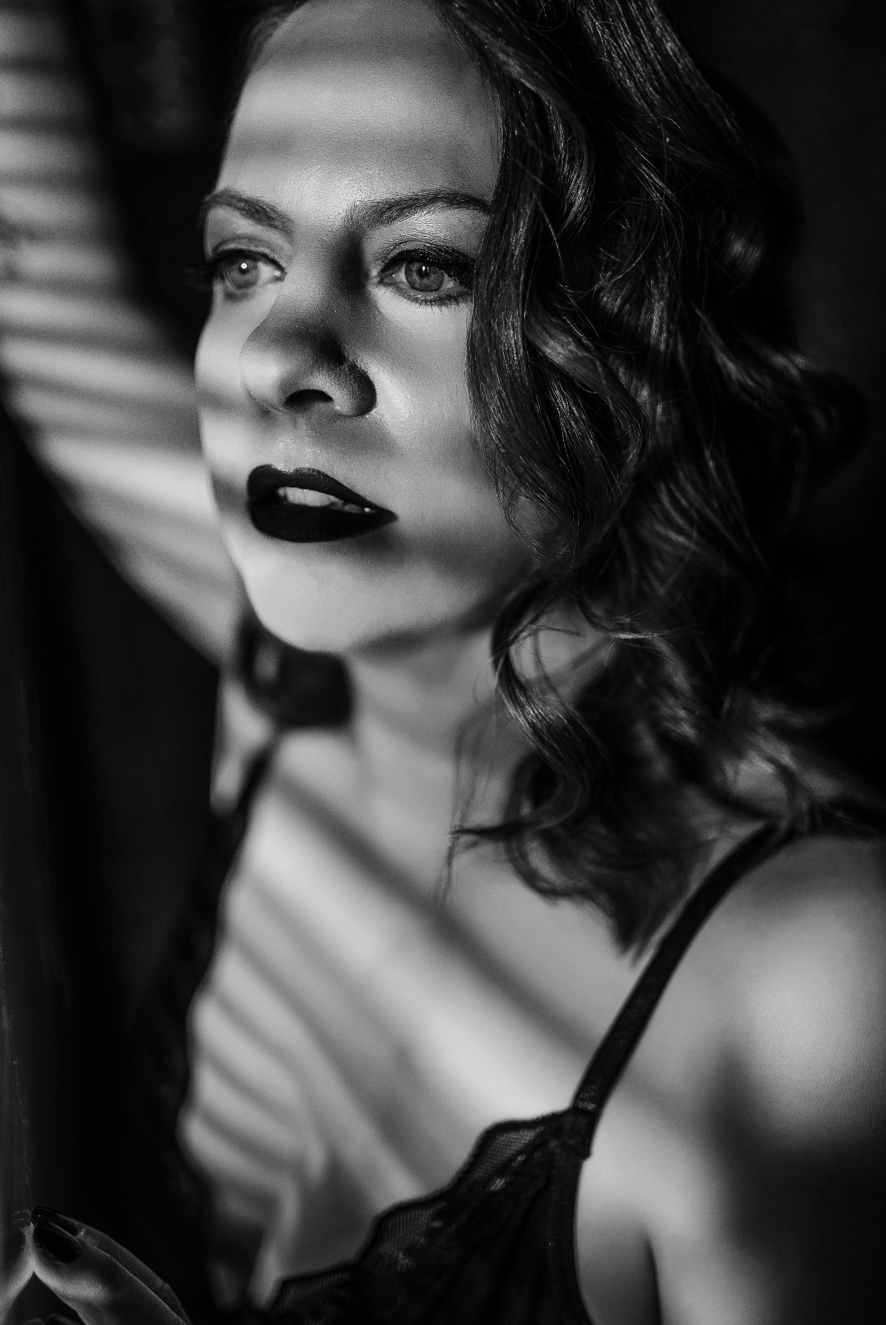 Fine art boudoir portrait session with romantic lighting and soft posing photographed at Boudoir by Hannah Rose studio