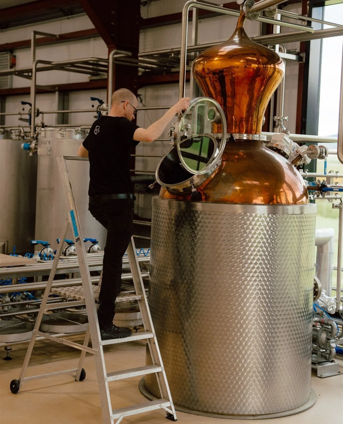 This is Martin at Rebecca, our 1,000-litre copper pot still.⁠
⁠
Working with care and precision, he combines overnight maceration with vapour infusion to capture the best from every botanical. It&rsquo;s a slower process, but one that allows even the
