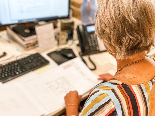 Christi working on design plans.