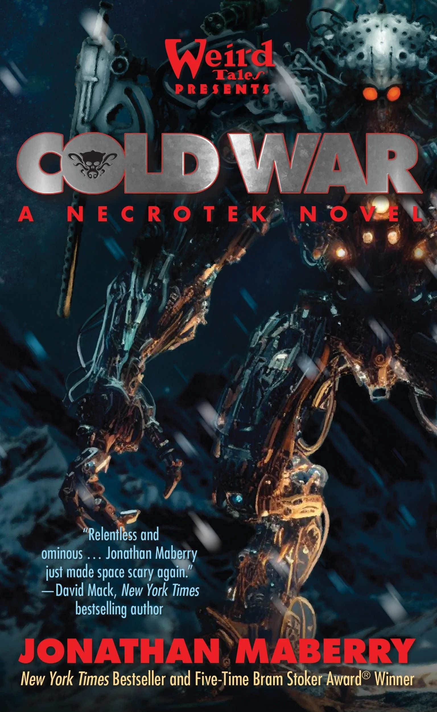 Book cover for "Cold War" by Jonathan Maberry. The cover features a menacing robot insect with glowing orange eyes, set against a dark blue, rain-swept background. The title "Cold War" is prominently displayed in large silver and red font, with the author's name in bold red at the bottom. The cover also includes a quote praising the book.