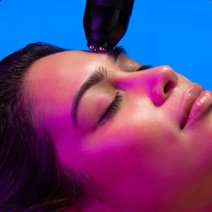 Client receiving Glo2Facial with RF Pro skin tightening treatment in Wayzata, MN to lift, firm, and stimulate collagen production.
