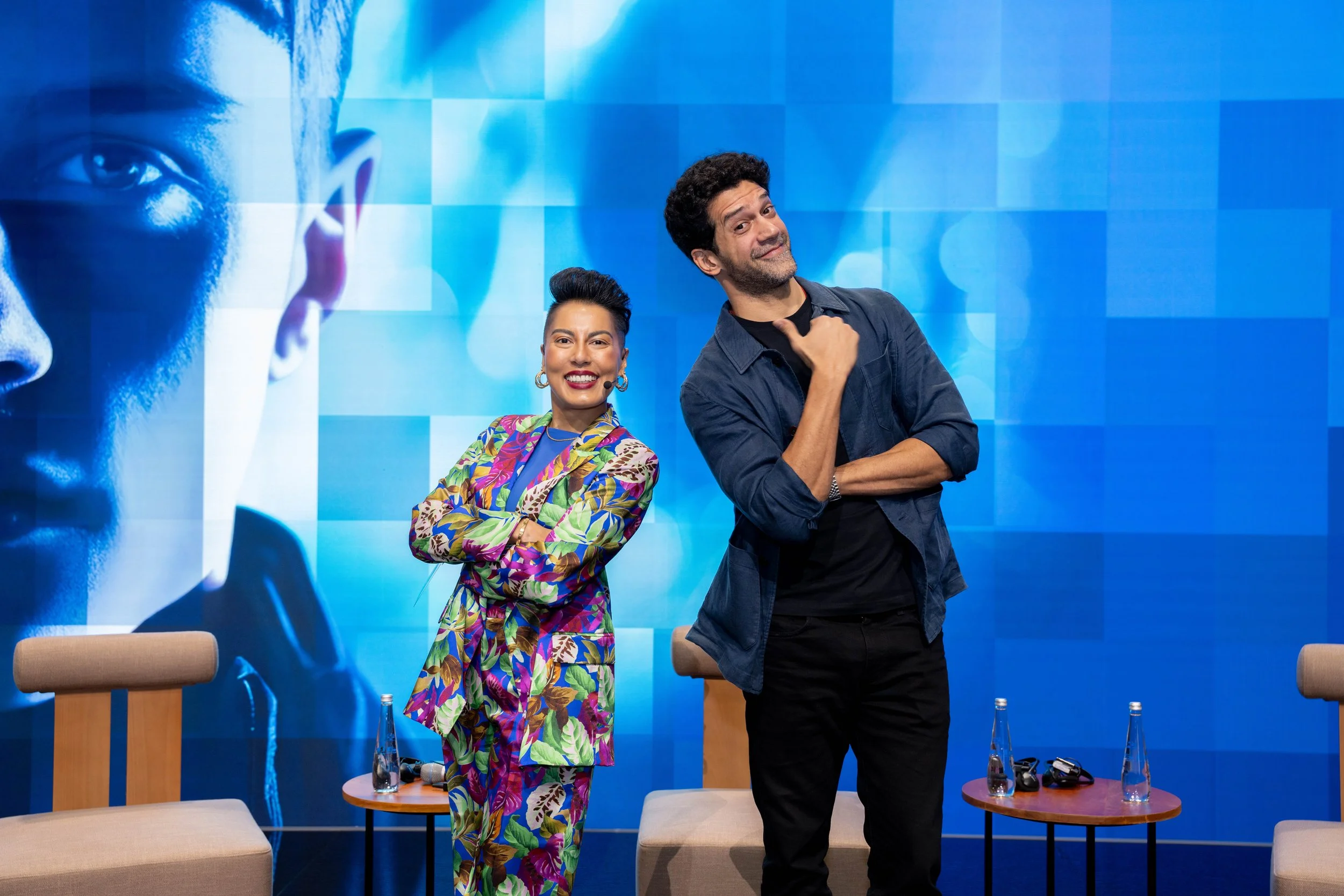 Sharon on stage with Ahmed Magdy while acting as an event host at The Bridge Summit in Abu Dhabi