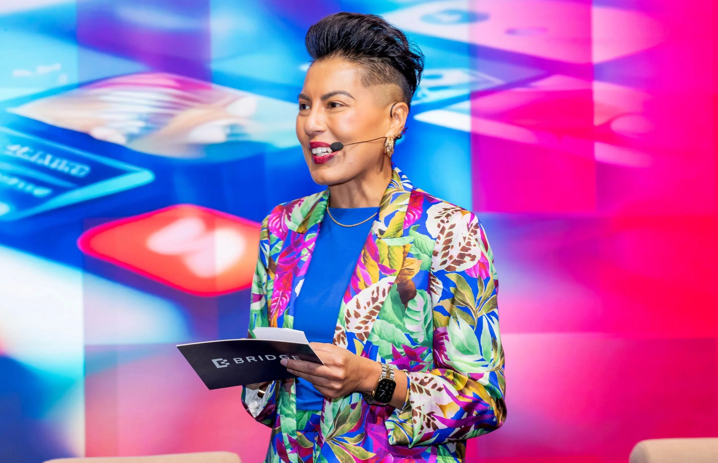 Sharon Pakir speaking on stage at the Bridge Summit event