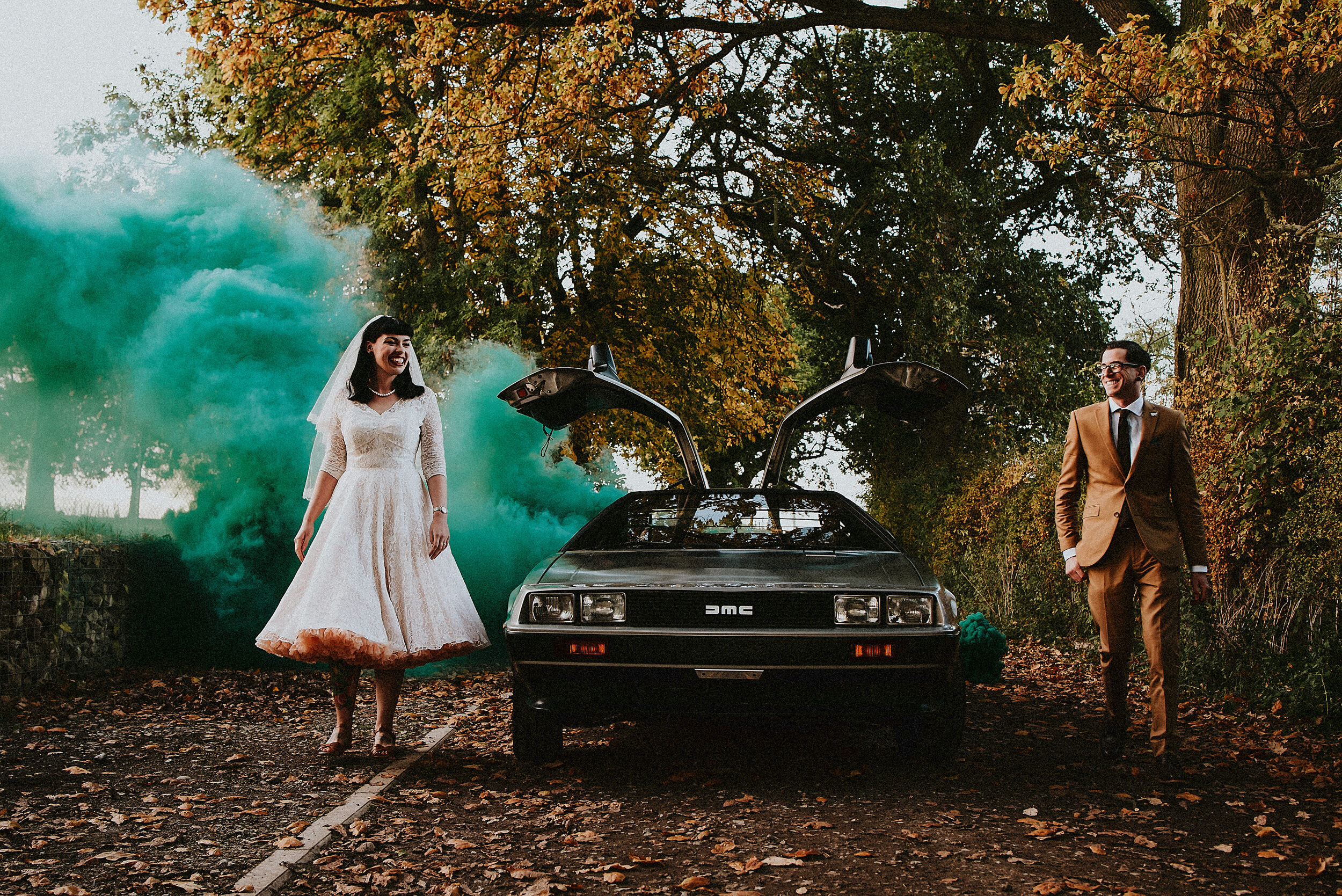 delorean-back-to-the-future-wedding-smoke-bombs-bride-groom-autumn-walking-alternative-wedding-thorner-victory-hall-colour-photo.jpg