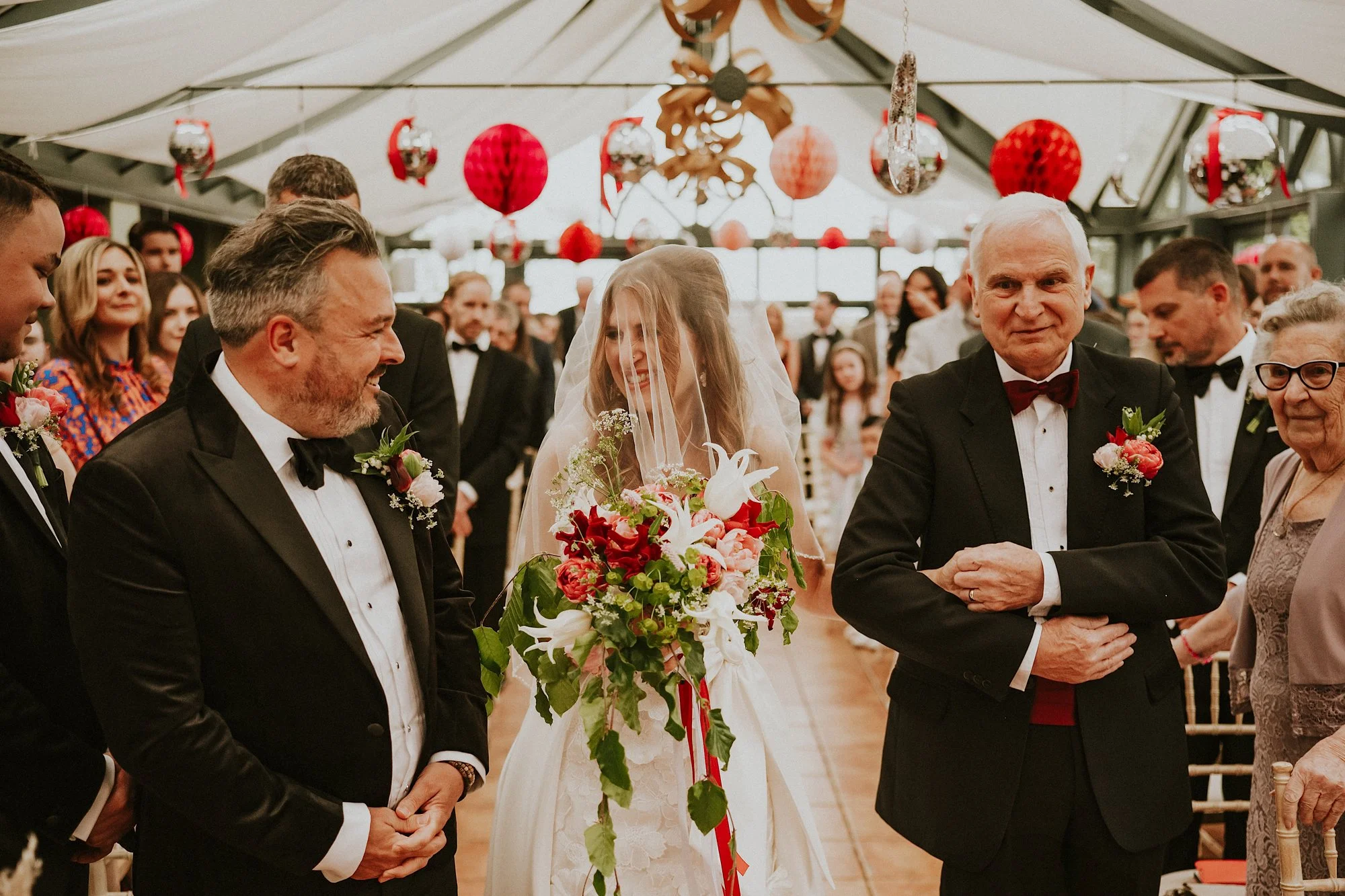 Titchwell Manor wedding ceremony. Mirror balls, colourful paper lanterns and a bride & grooms first look that resonates with love.
