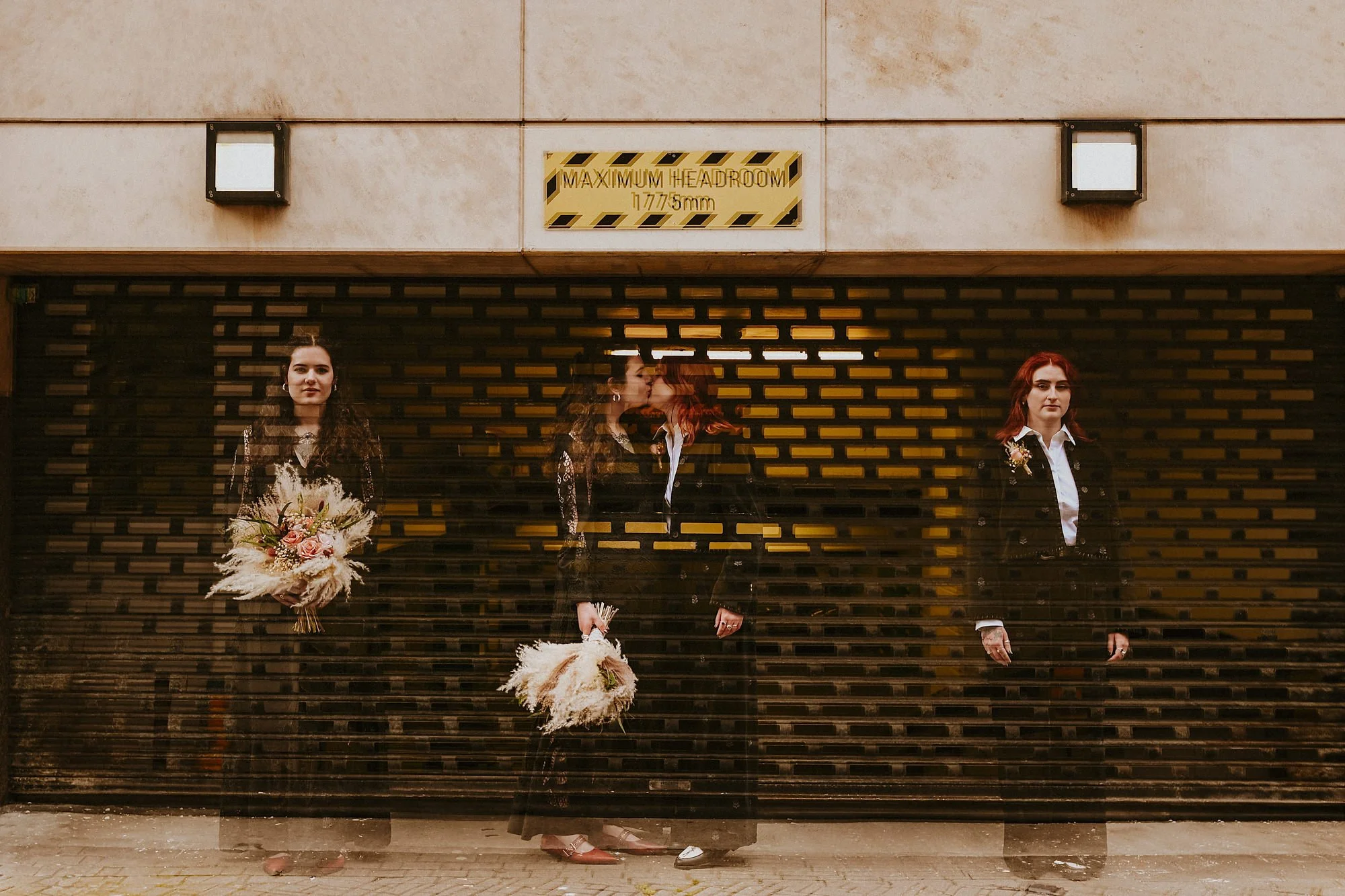 A double exposure outside a car park of two Brides kissing in this Shears Yard wedding.