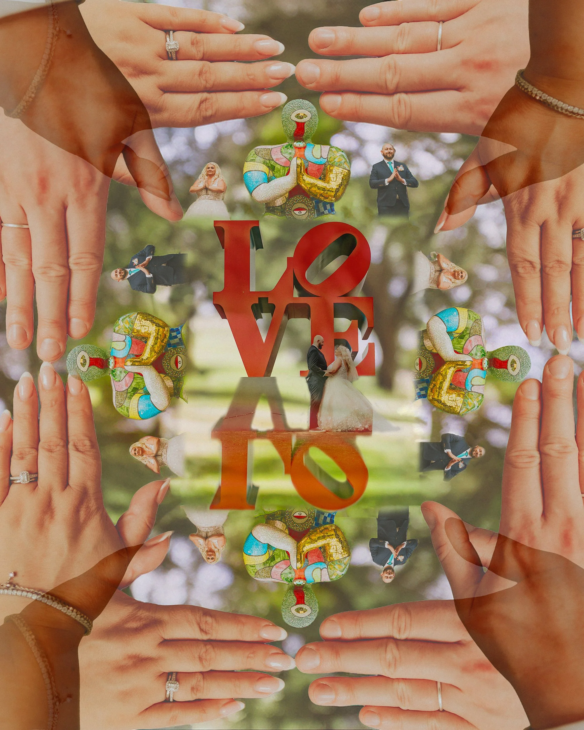 Alternative wedding photography in a Yorkshire Sculpture Park wedding. The Bride & Groom stand amidst a montage of colourful sculptures. A love sign Buddhist prayer and hands frame an embrace.