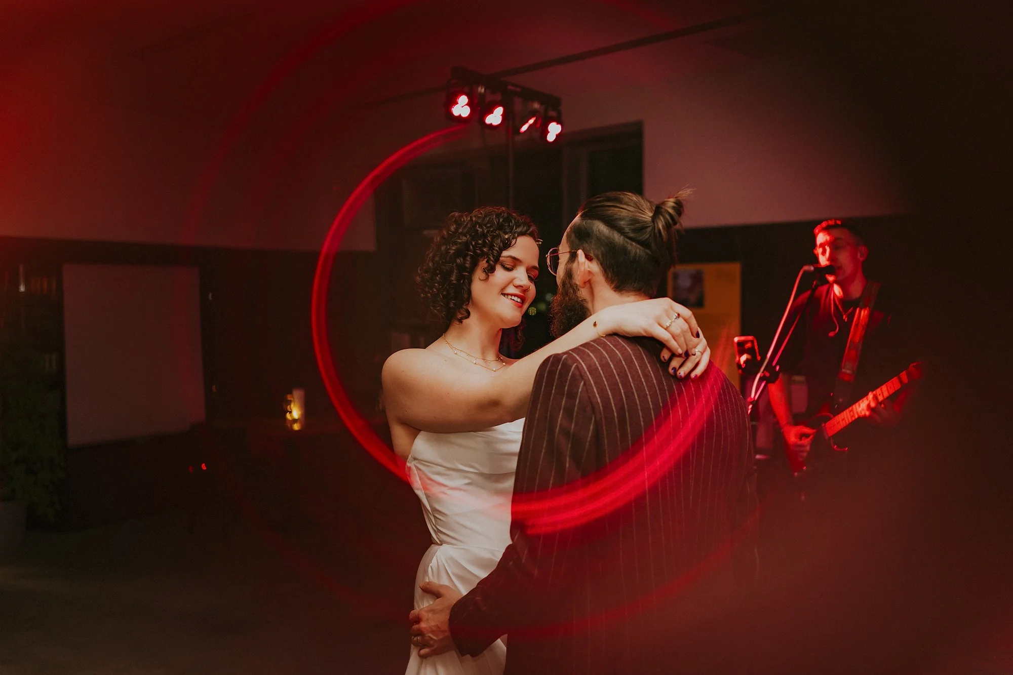 A quirky first dance photo of a couple inside a ring of fire creative photography technique during their Hepworth Wakefield wedding.
