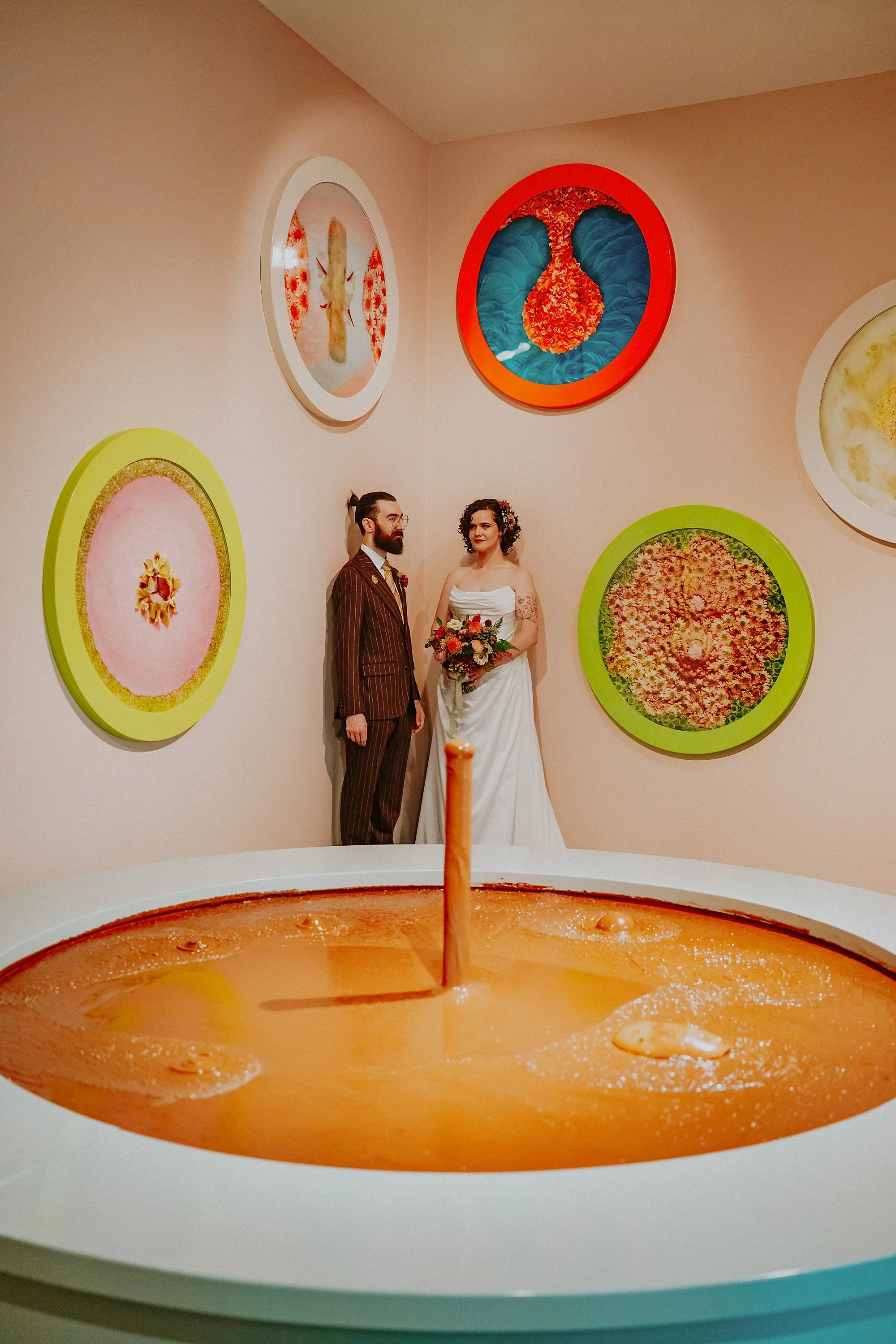 Helen Chadwick's chocolate fountain in the foreground of a portrait of a Bride and Groom in this Hepworth wakefield wedding.