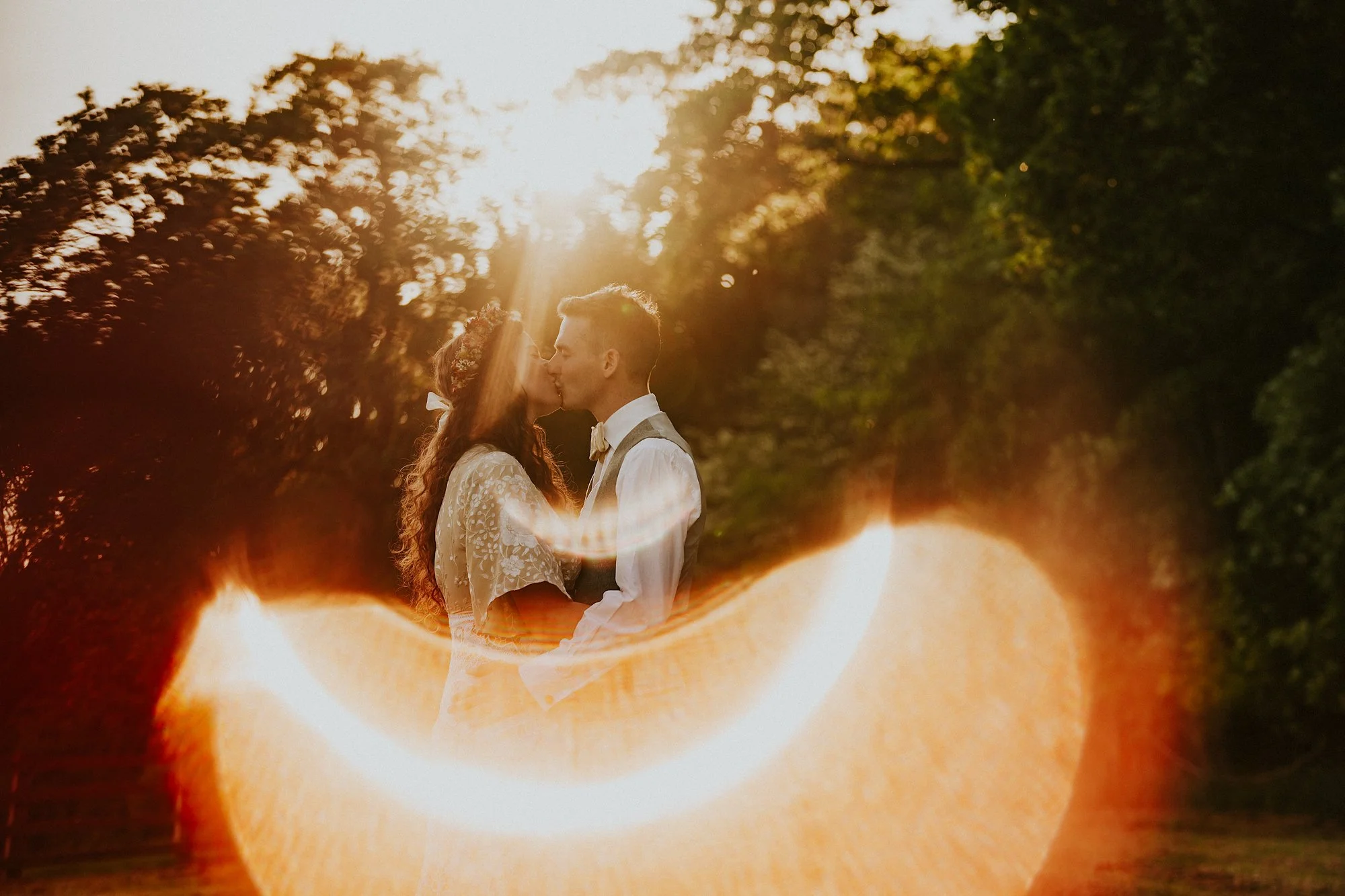 Beautiful golden hour light over at This Green Moon in Leeds. The couple celebrate their wedding with a kiss.