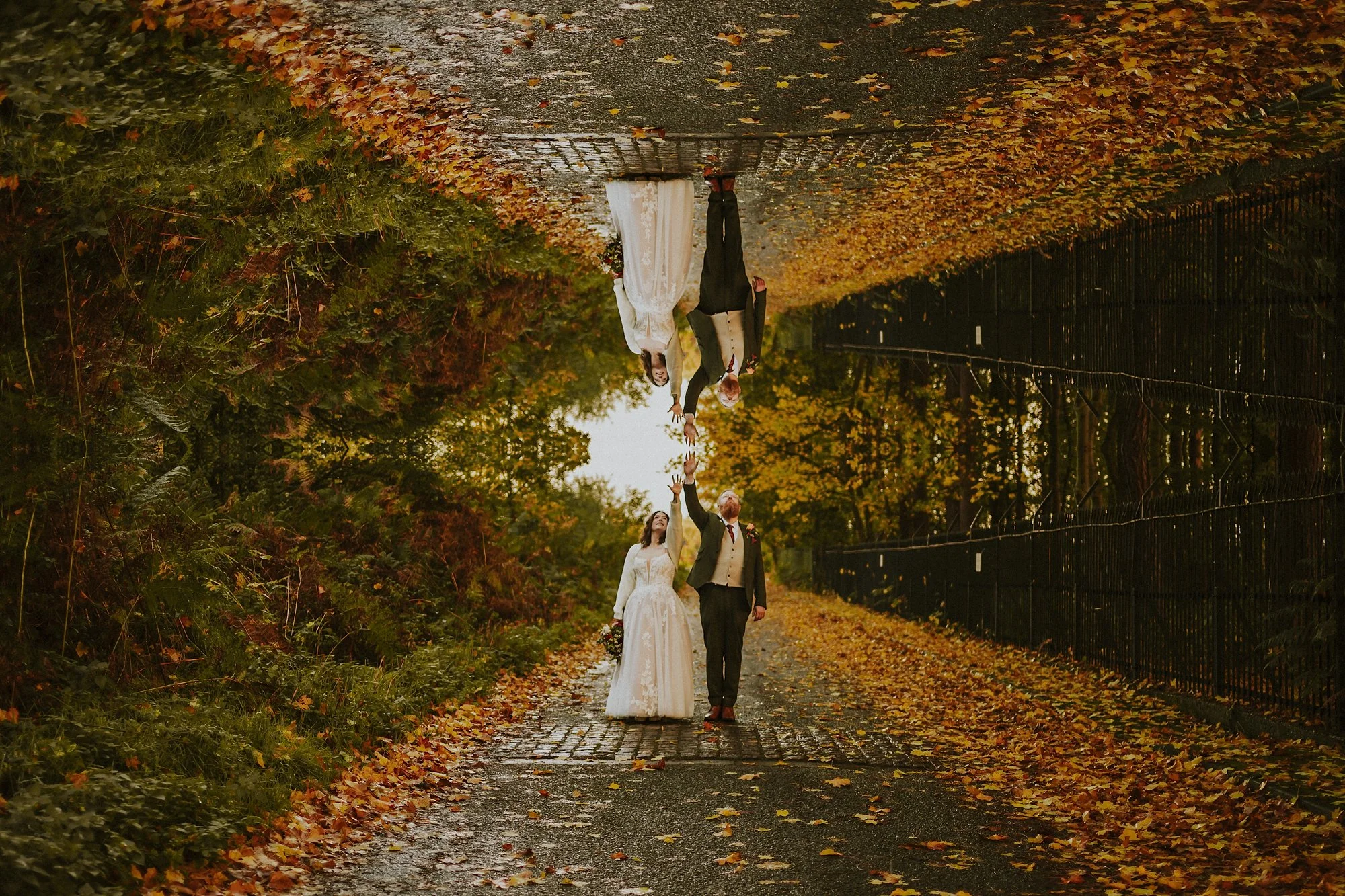 A Pumping House Ollerton wedding portrait of a Bride and Groom in a surreal mirror image where hands meet.