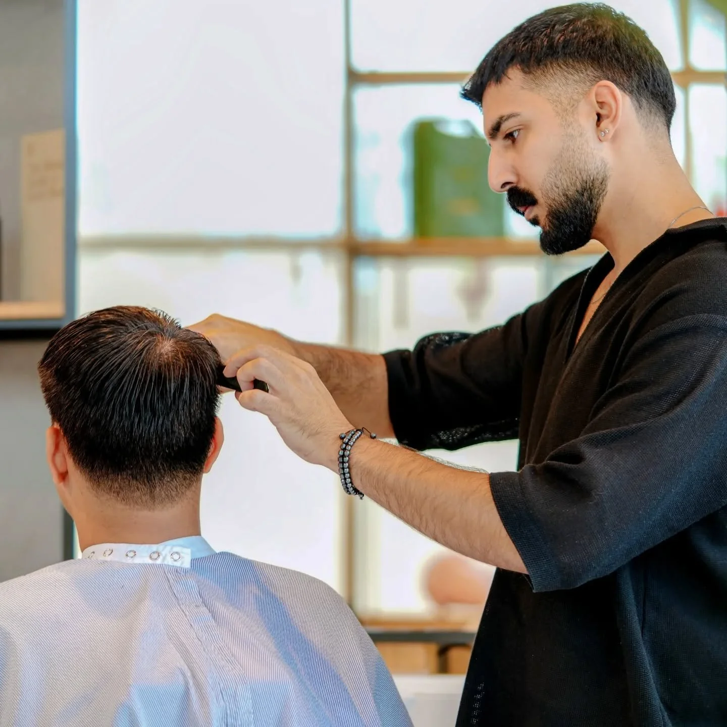 Bahadour the barber, doing what he does best every day.@bahador_beygii 
#weareakin