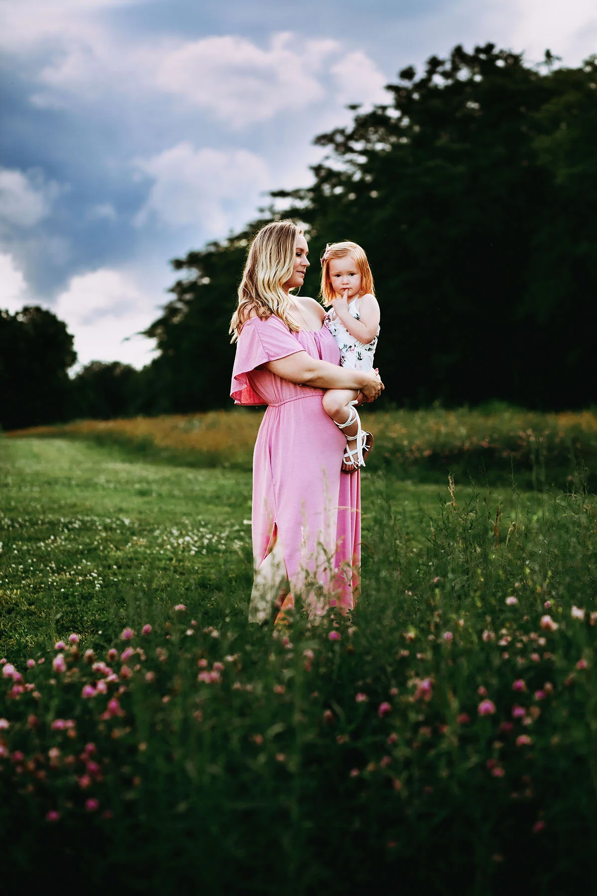 A family photograph of a beautiful mother and daughter by Cleveland Lake in Belton, Missouri