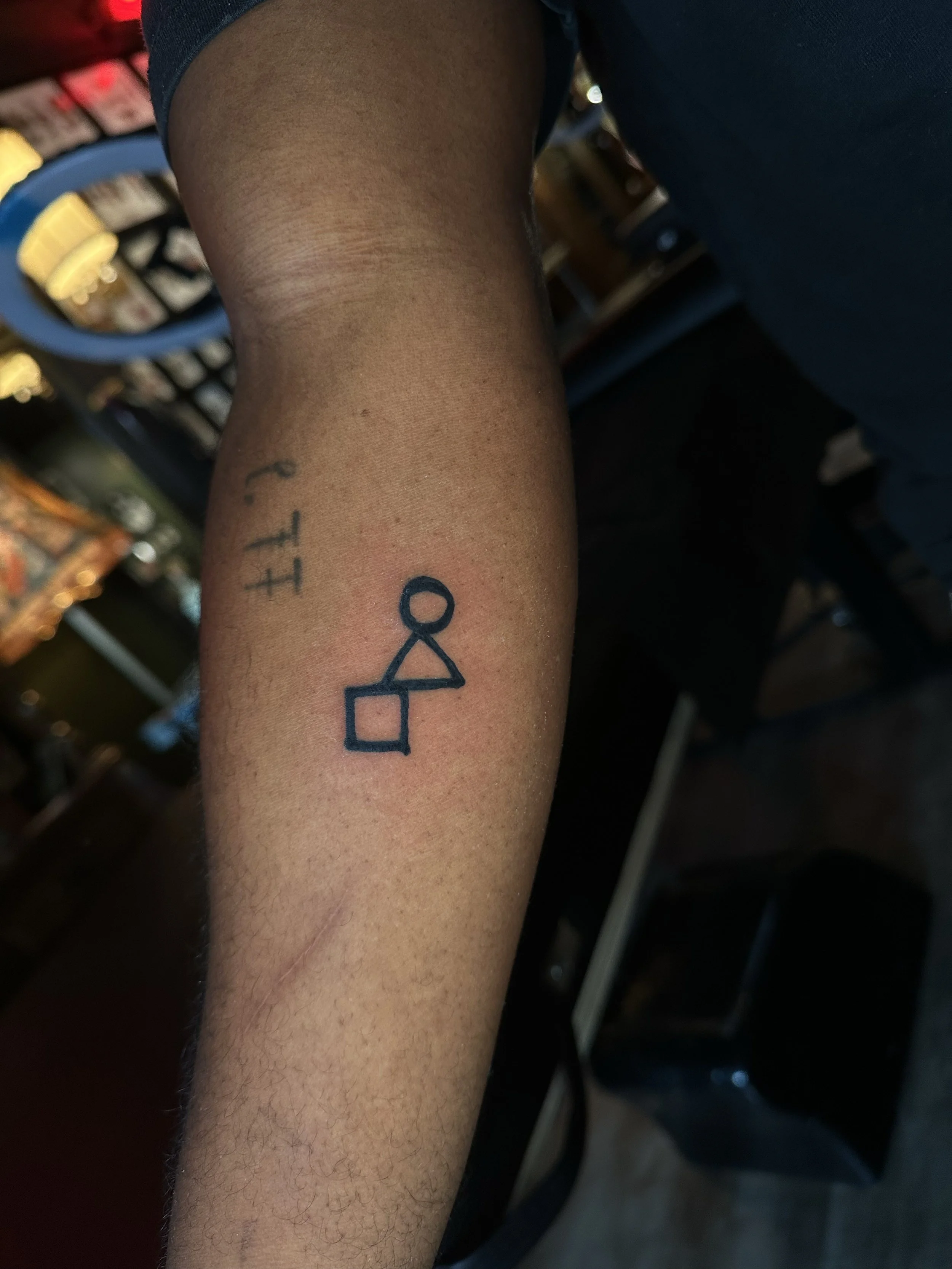 May Kineyetums and Micah Lexier, documentation photography from Asterisms: Say the Word, 2026. Tattoo documentation photo: May Kineyetums Kimmapiiypitsinni Tattoo Courtesy of Brendan Browne and Nectar Fine Tattooing.