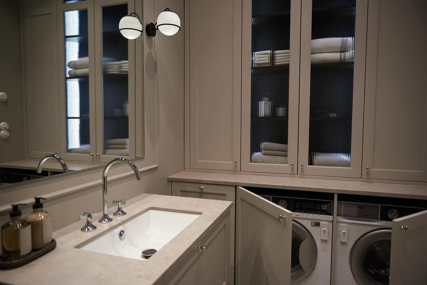 Bathroom with concealed Laundry Appliances: A clever design where the vanity not only serves its primary purpose but also hides laundry appliances, maintaining a seamless and organized look.

#bathroomdesign #bathroomrenovation #birchandwood #interio