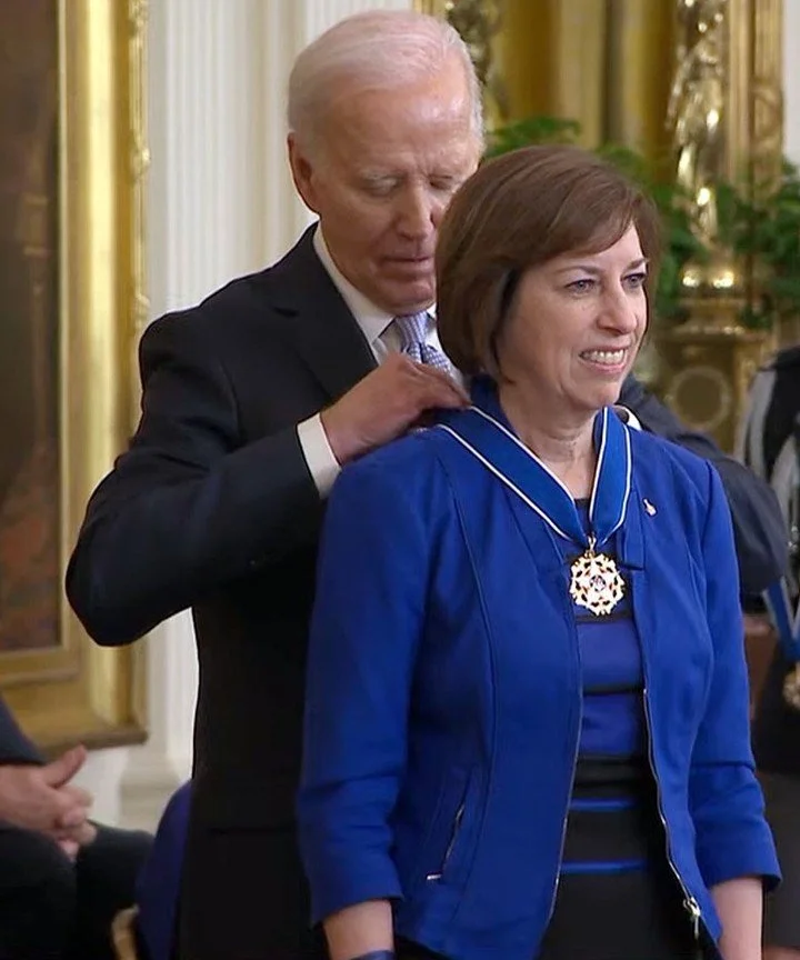 President putting medal around neck.JPG