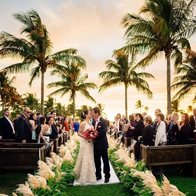 I'm taking a trip down memory lane with this beauty. We lined the aisle with pampas grass before pampas grass was even a thing and @mattsteeves captures the perfect shot with those palm tree and that beautiful sky. ⁣
. ⁣
Planning &amp; Design: @kellyamcwilliams⁣
Photo: @mattsteeves⁣
Floral: @signatureflorals⁣
Venue: @ssislandresort⁣
⁣
⁣
#floral #ssislandresort #ssislandresortwedding #southseasweddingplanner #ssislandresortweddingplanner #captivaweddingplanner #captivawedding #captivaislandwedding #luxuryweddingplanner #destinationweddingplanner #bridalmarket #weddingplanning #weddingplanner #weddinginspiration #weddinginspo #weddingstyle #weddingflowers #eventplanner #luxurywedding #weddingceremony #weddingideas #weddingdetails #weddingexpert #weddingcoordinator #weddingseason