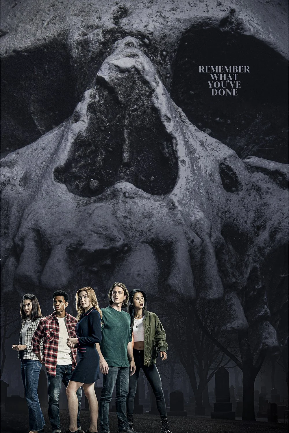 A dark, eerie scene featuring a large animal skull with prominent eye sockets and nasal cavity in the background, overlaid with five young adults standing in a graveyard at night. The text 'Remember what you've done' appears near the skull.