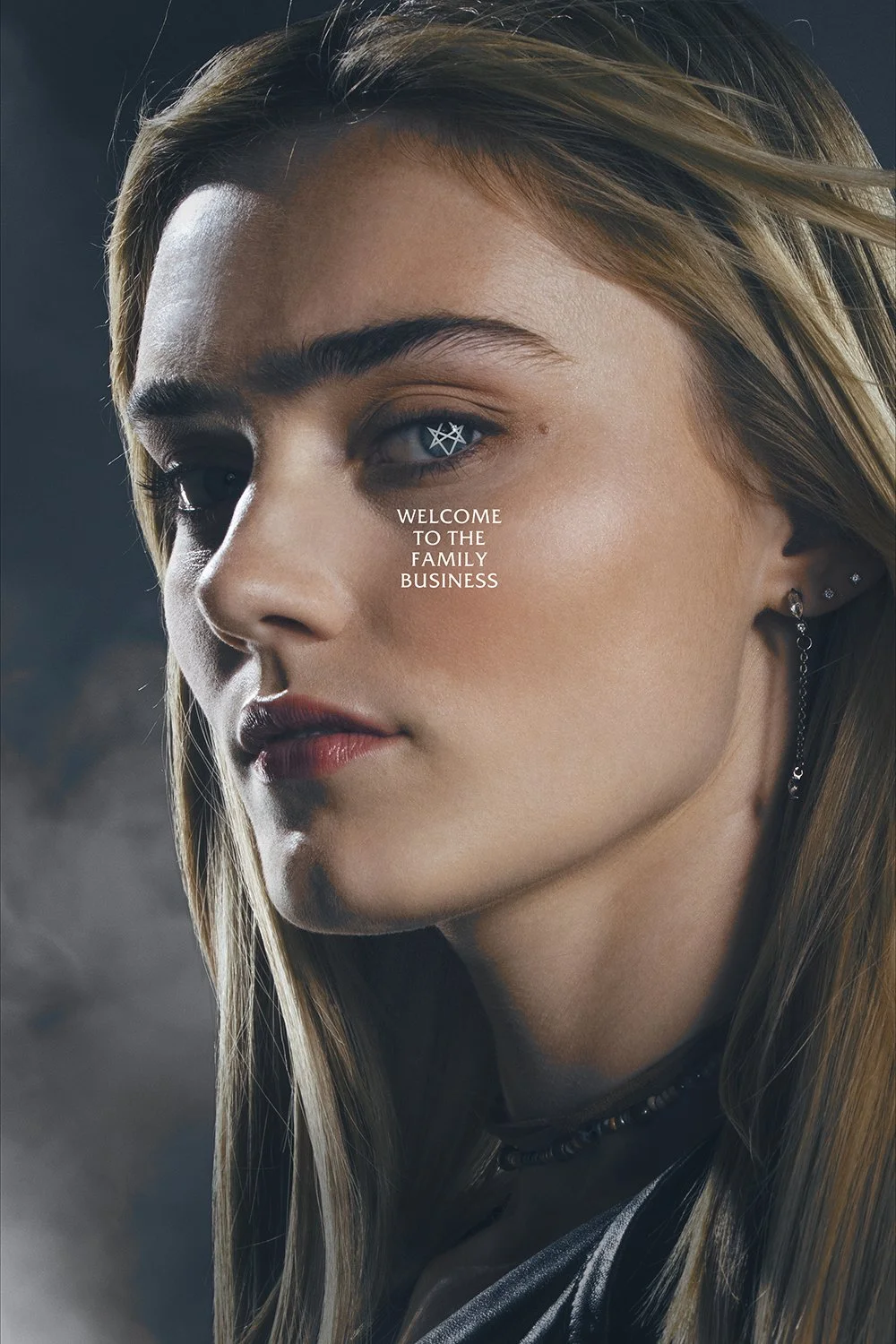 A close-up of a young woman's face with makeup and jewelry, with text overlay saying "Welcome to the family business."