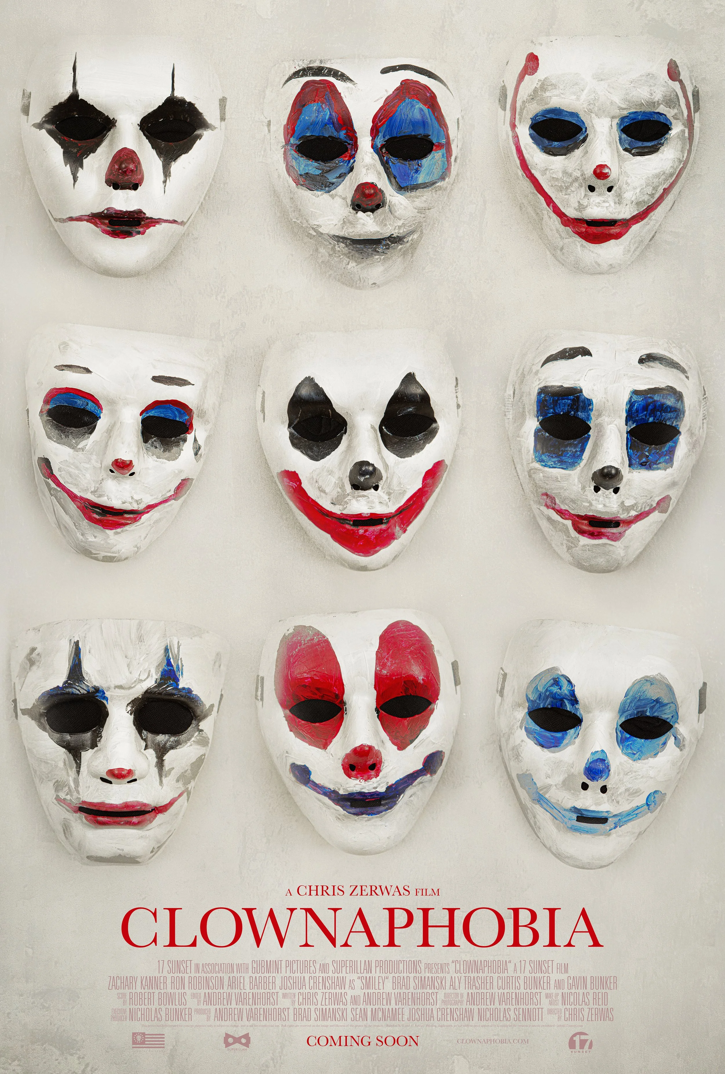 A poster for the film 'Clownaphobia' featuring six clown masks arranged in two rows, each with different painted facial expressions and colors, against a light background. The title 'Clownaphobia' is in large red letters at the bottom, with additiona