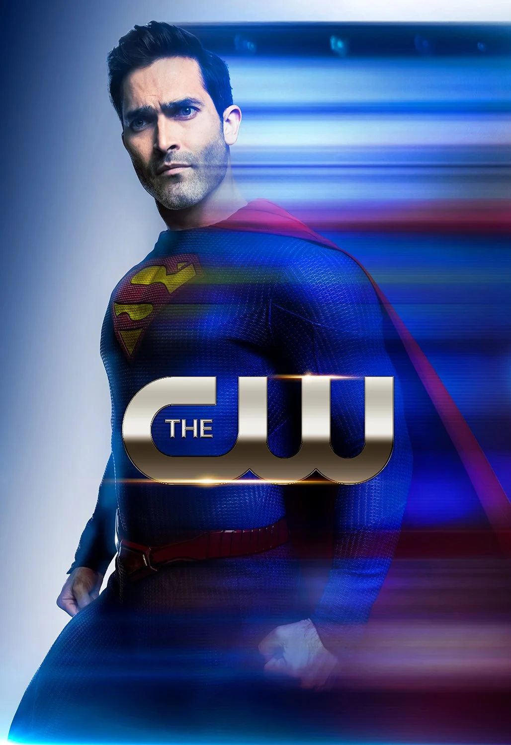 Promo poster for the TV show "The CW" featuring a man dressed as Superman with a serious expression, blue suit with red cape, and the iconic 'S' emblem on his chest. The background has a blurred, streaked effect with blue and red hues.
