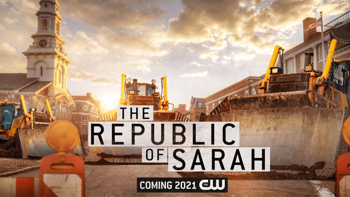 Three bulldozers parked on a city street with historic buildings and a clock tower in the background at sunset, promotional text for the show "The Republic of Sarah" coming in 2021 on CW.