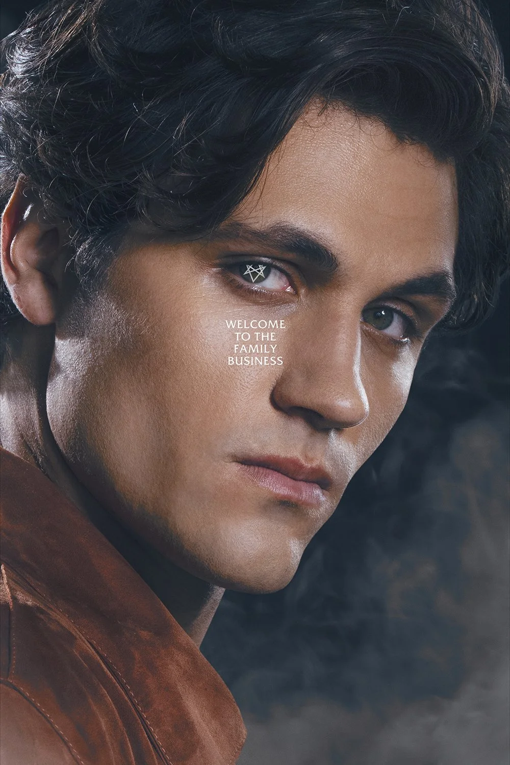 Close-up of a young man with dark hair and tan skin, looking intently at the camera. Text overlay says, 'Welcome to the family business.'