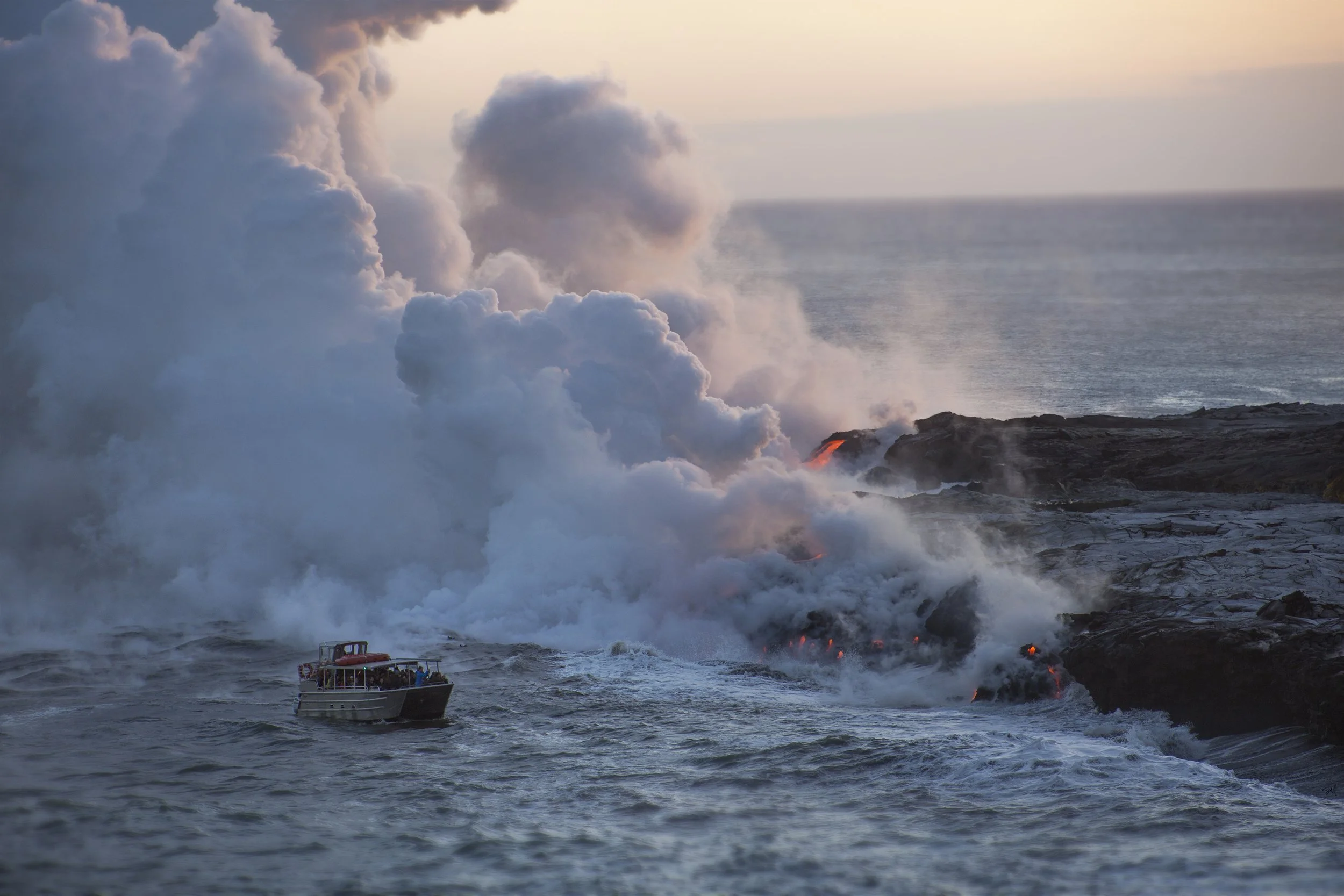 A boat sailing near coastlines with erupting volcanoes spewing ash and lava into the sky, alongside ocean waters.