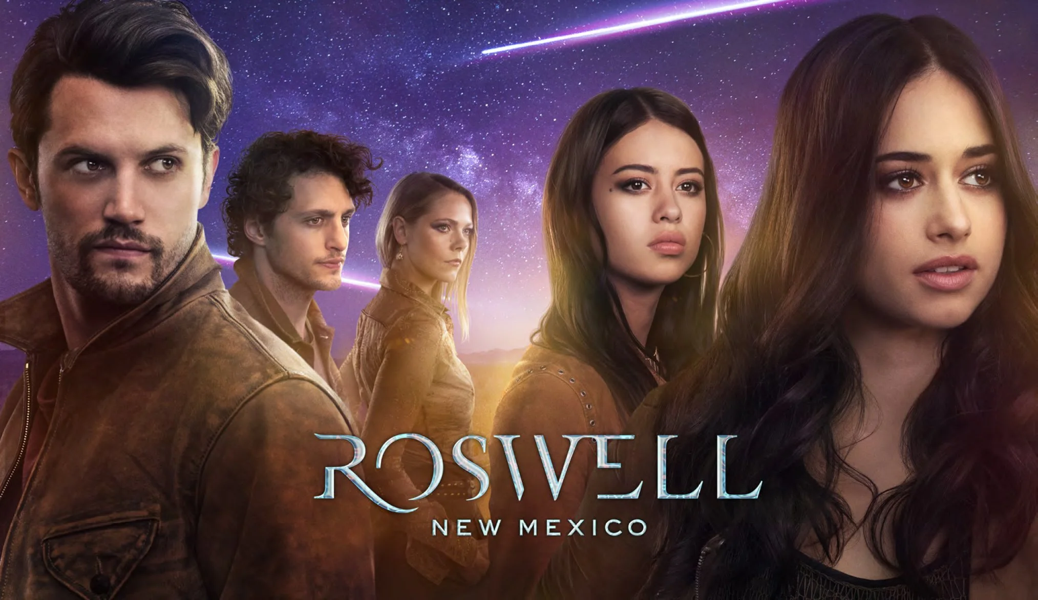Promo poster for the TV series "Roswell, New Mexico," featuring five main characters standing against a starry sky with a shooting star and the moon in the background.