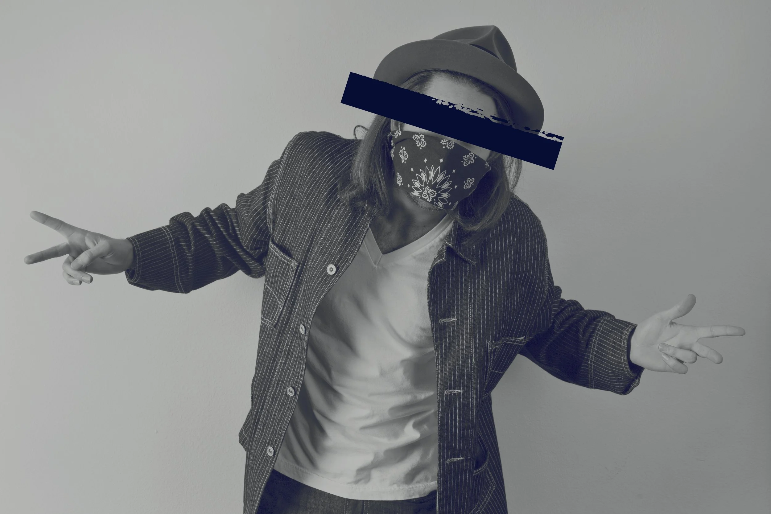 A gangster wearing a hat throwing upon a gang sign. Photographed on a white background.