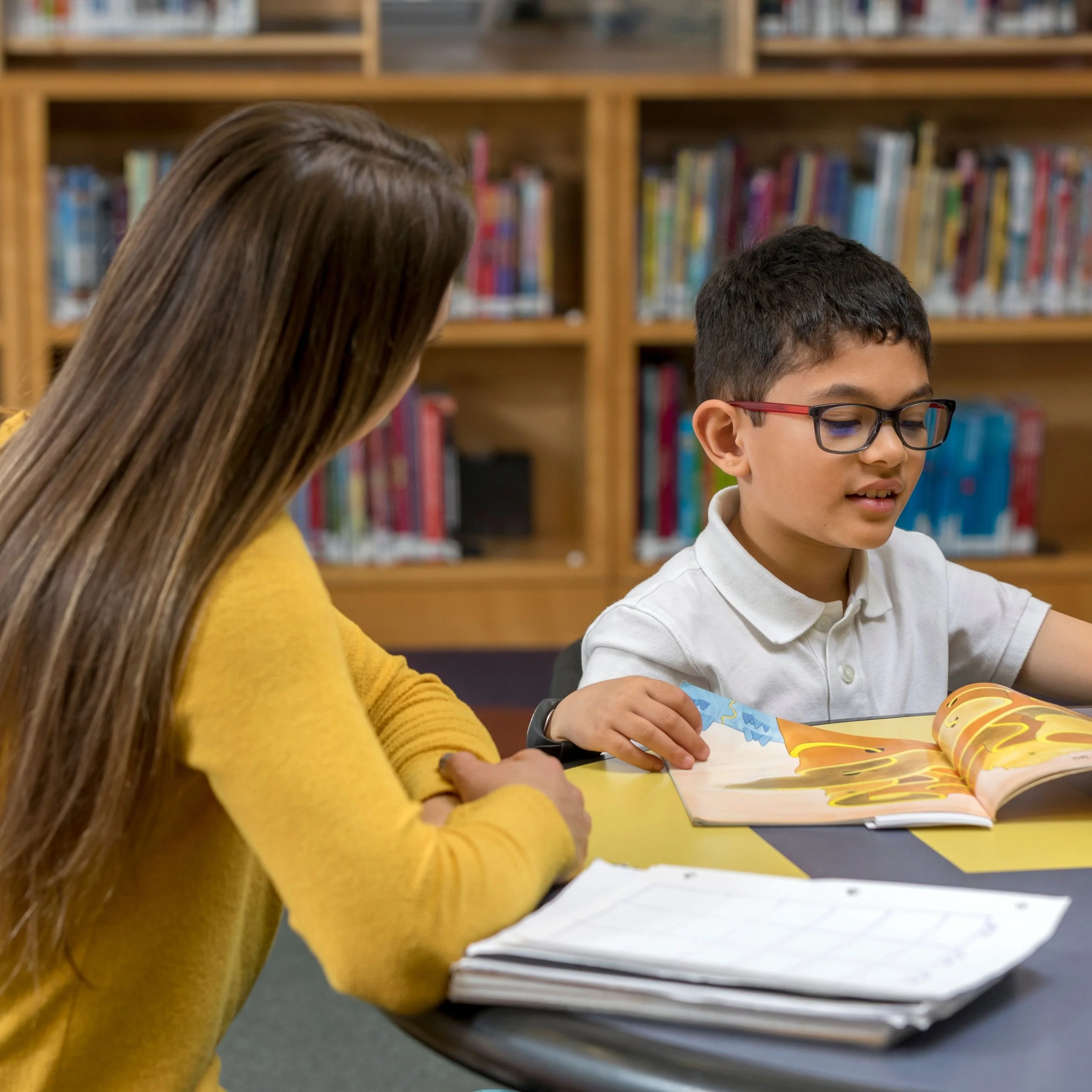 A U2 student works with a U2 tutor towards the Haberdashers' Boys' 7+ exam