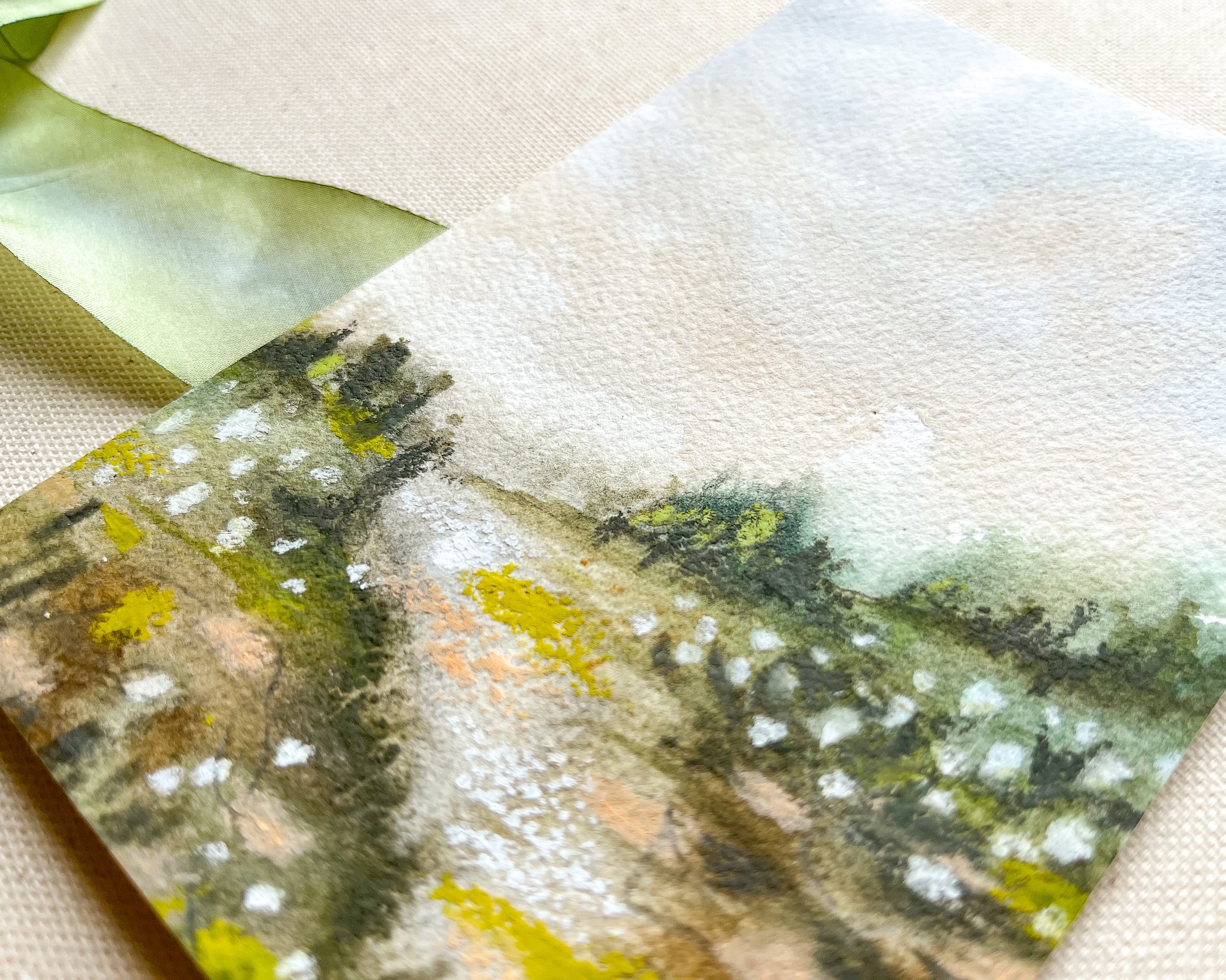 Detailed view of mixed media landscape artwork. Painting in watercolor with pastel accents.