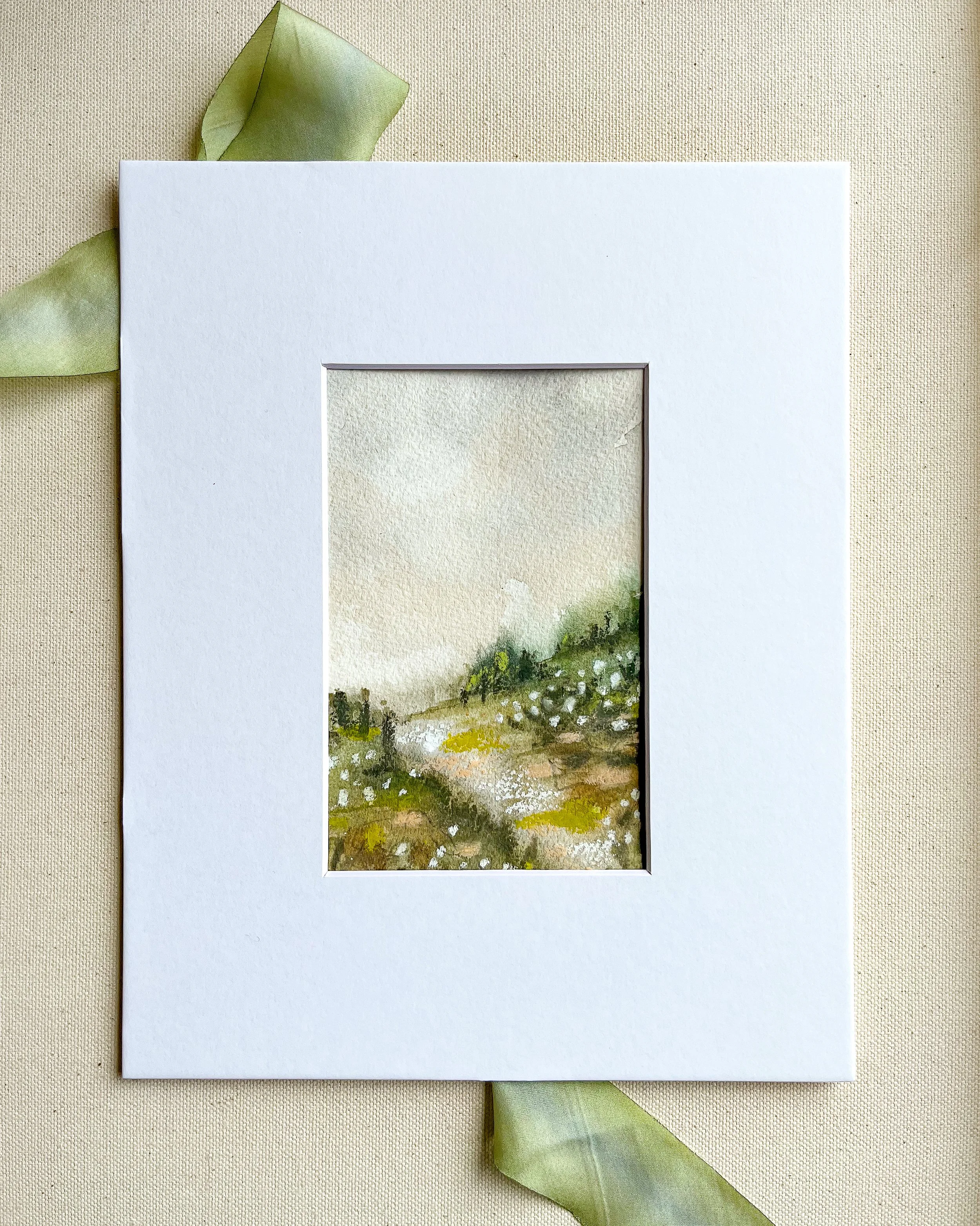 Landscape painting photographed in actual mat offered as an upgrade. Acid free mat is white and measures 8" x 10" with an opening just under 4" x 6".