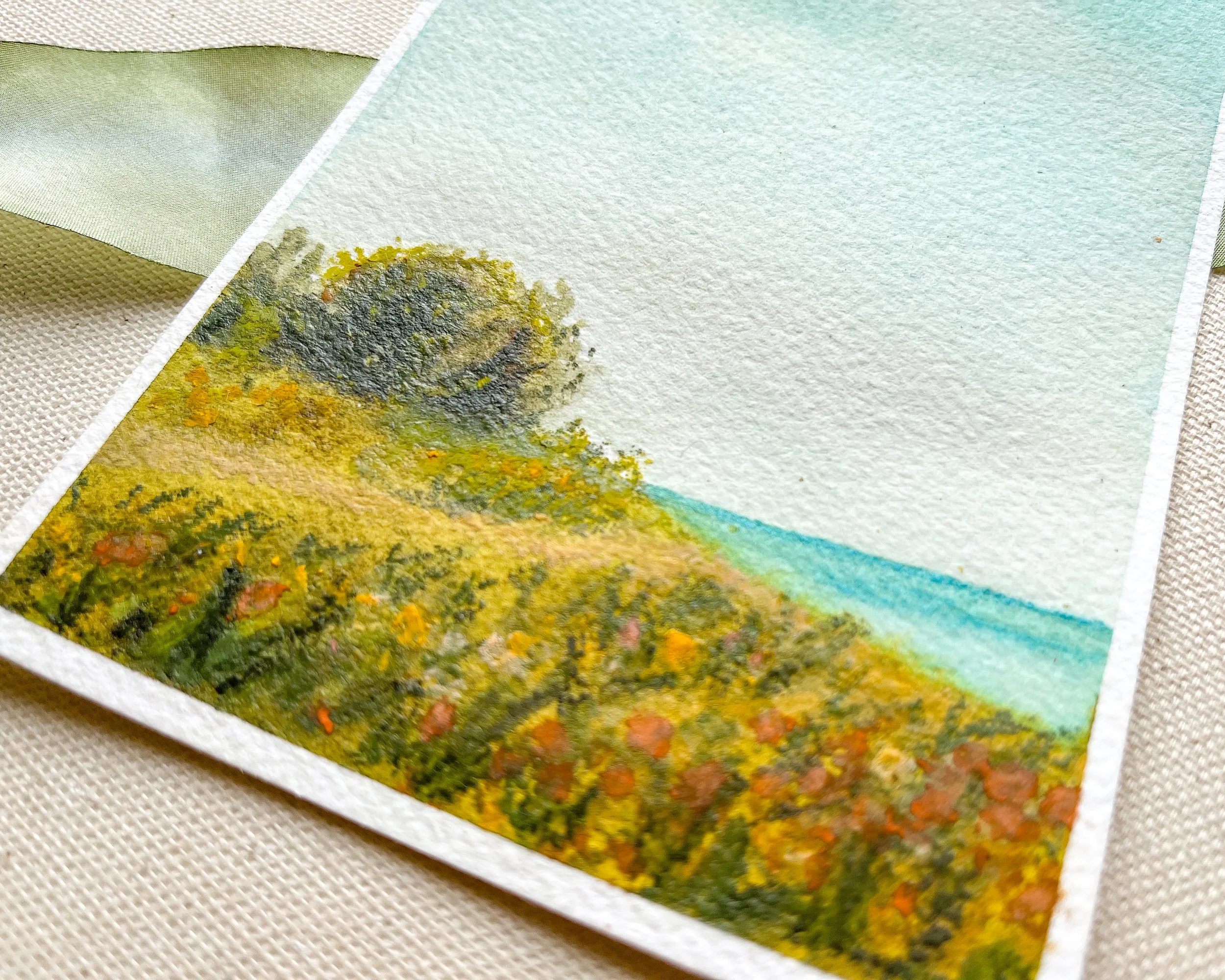 Detailed view of mixed media beach painting in watercolor and pastels