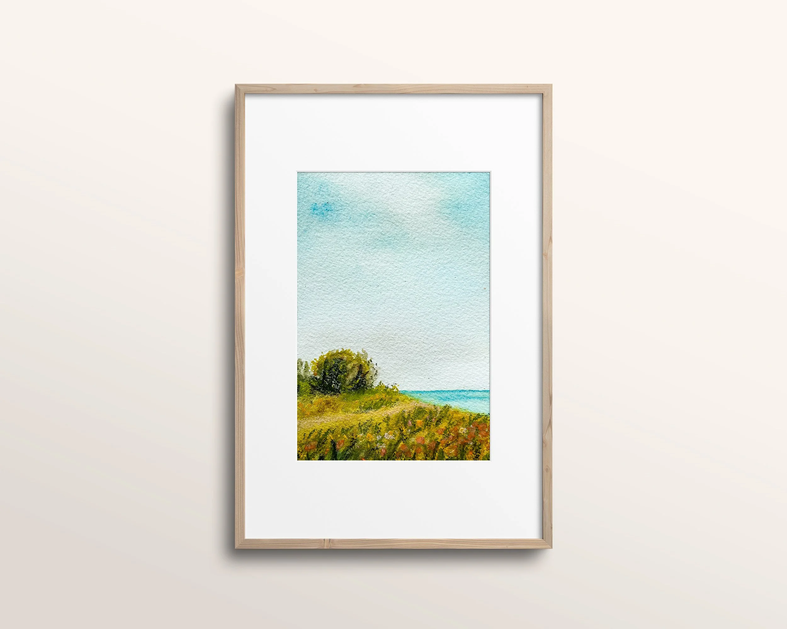 Mixed media beach painting shown in minimalist wood frame with white mat