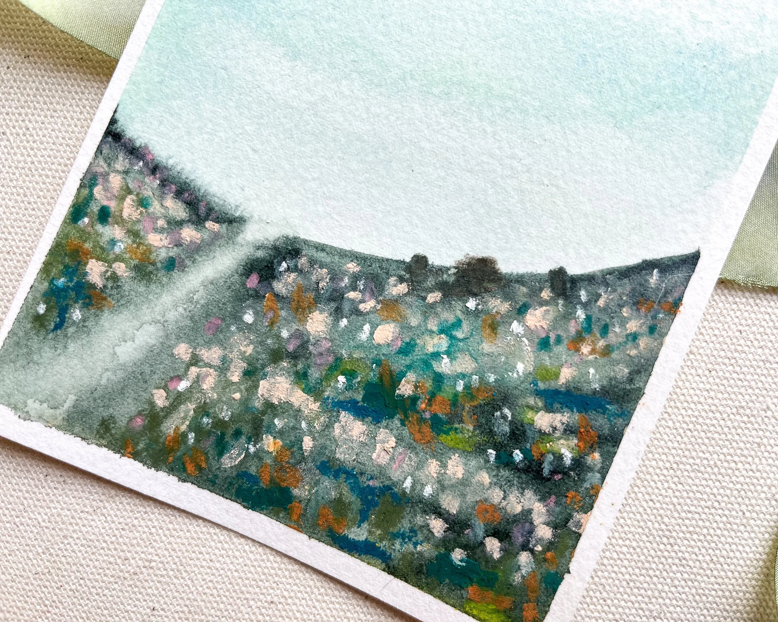 Blue abstract mixed media landscape painting in detail close up