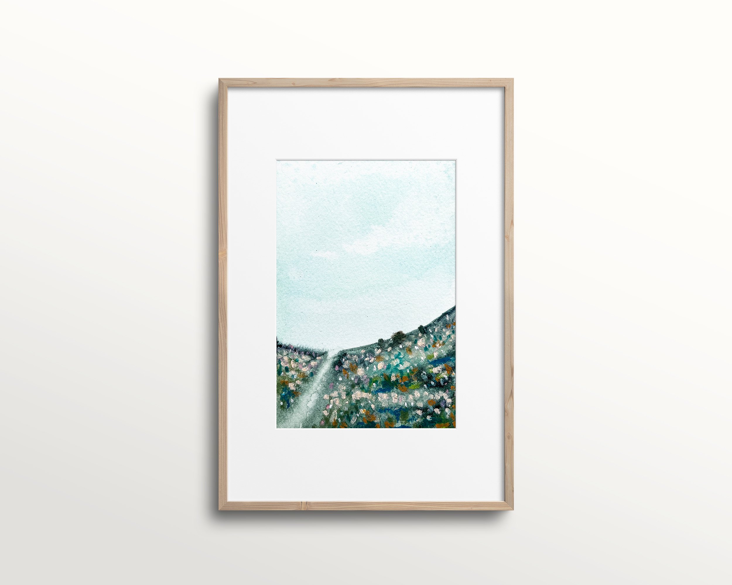 Blue abstract mixed media landscape painting shown in frame with white mat