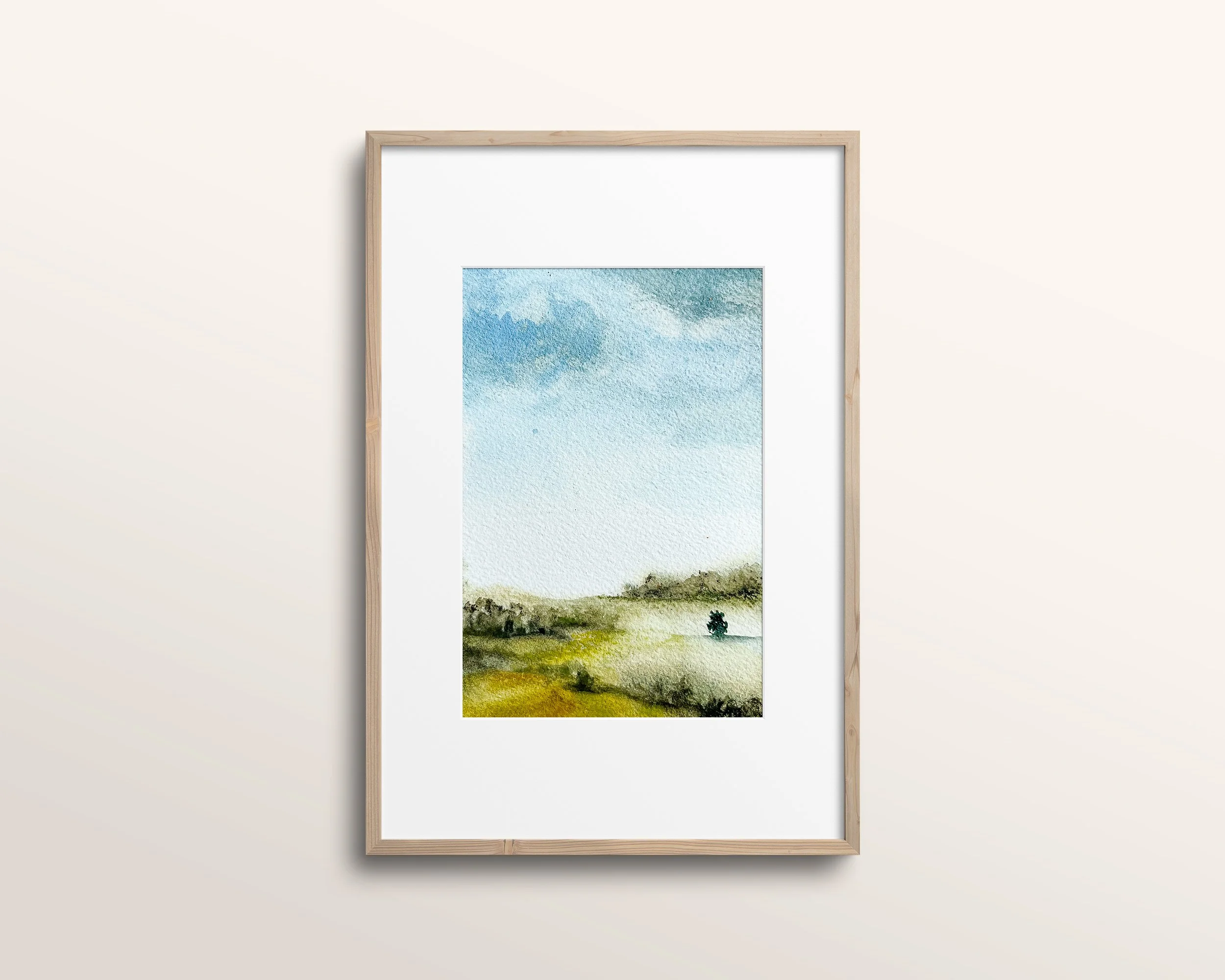 Watercolor landscape painting show in thin wood frame in white mat