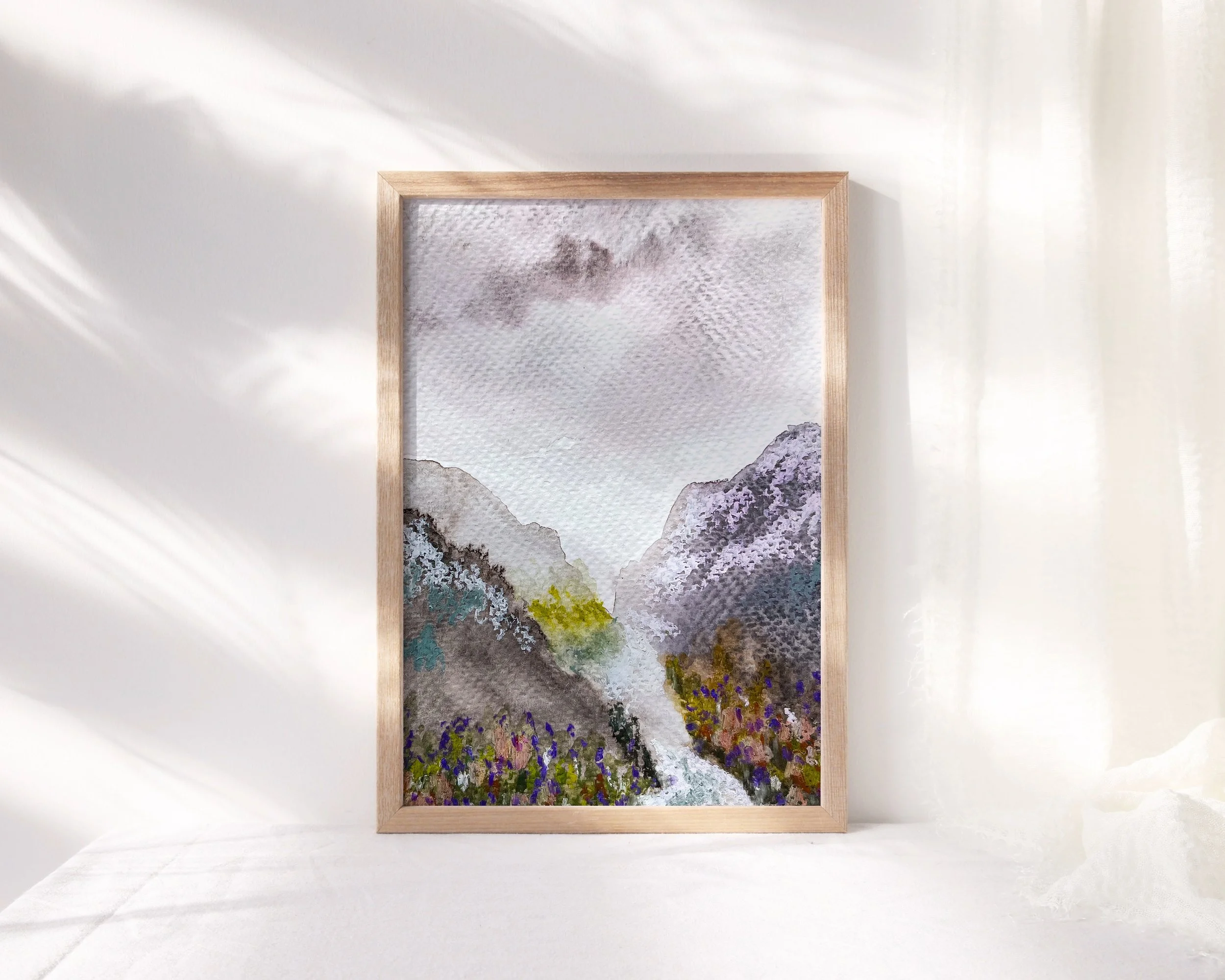 Mixed media mountain valley landscape painting shown in wood frame
