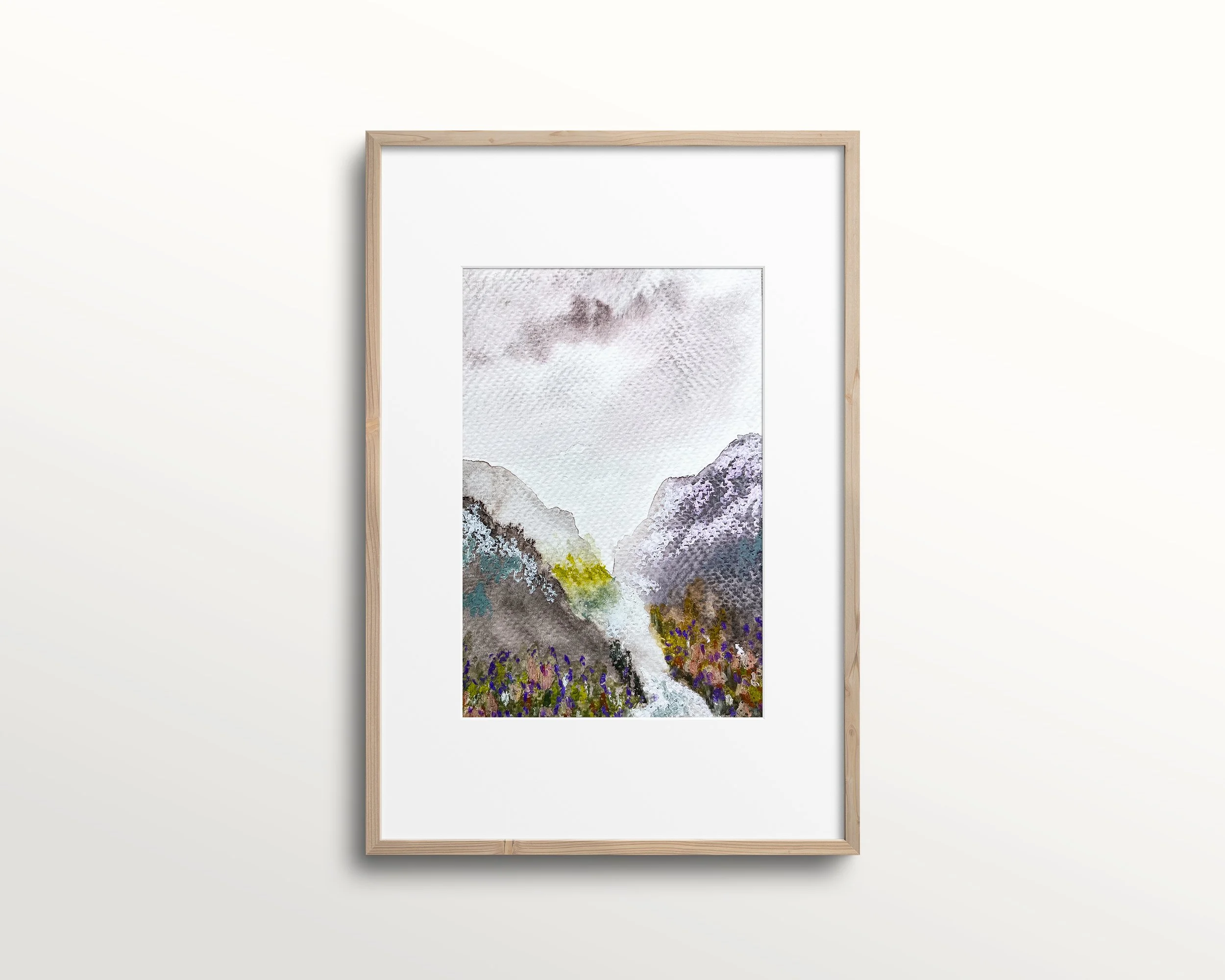 Mixed media mountain valley shown in wood frame with white mat