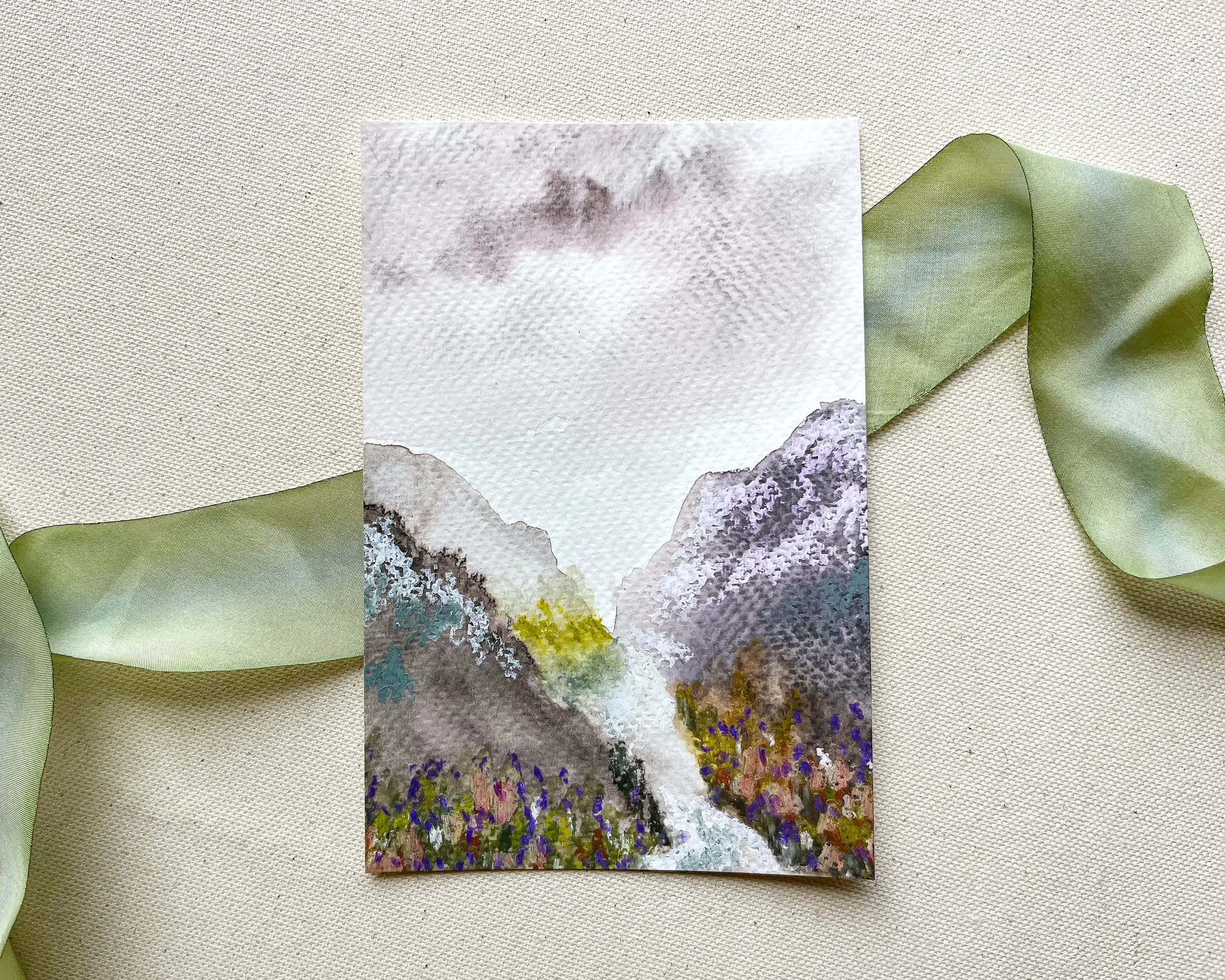 Original mixed media painting of a purple mountain valley in watercolor and pastels