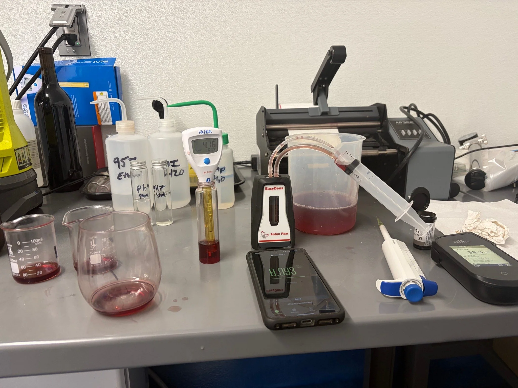 Testing time! Measuring pH, temp, free SO2, and specific gravity. Regular testing helps ensure oxidation and possible spoilage microorganisms are held in check, and to see if there is any ongoing fermentation, but TASTING is just as important.

 Is t