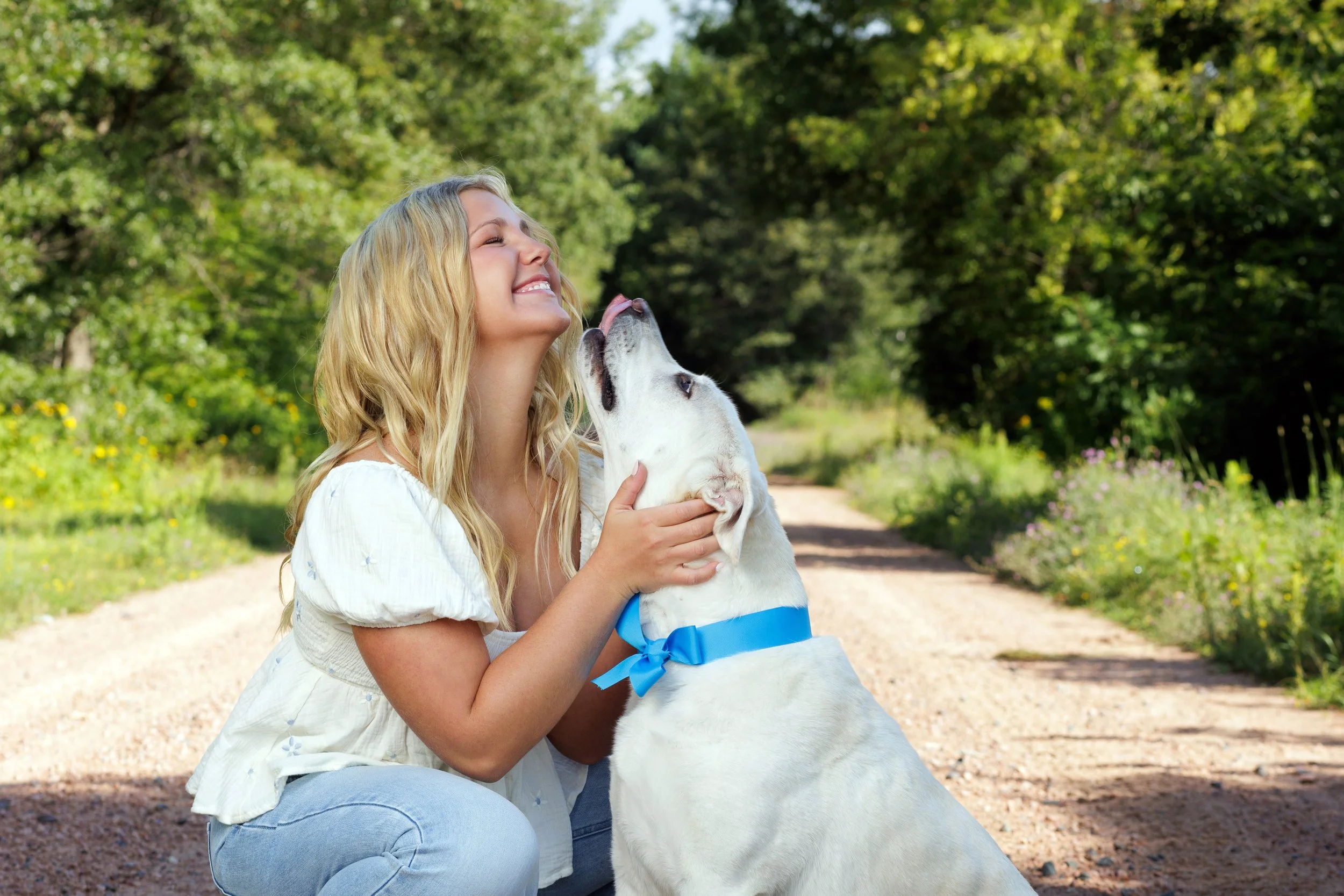 Senior portraits with a dog by Seasons Photography.